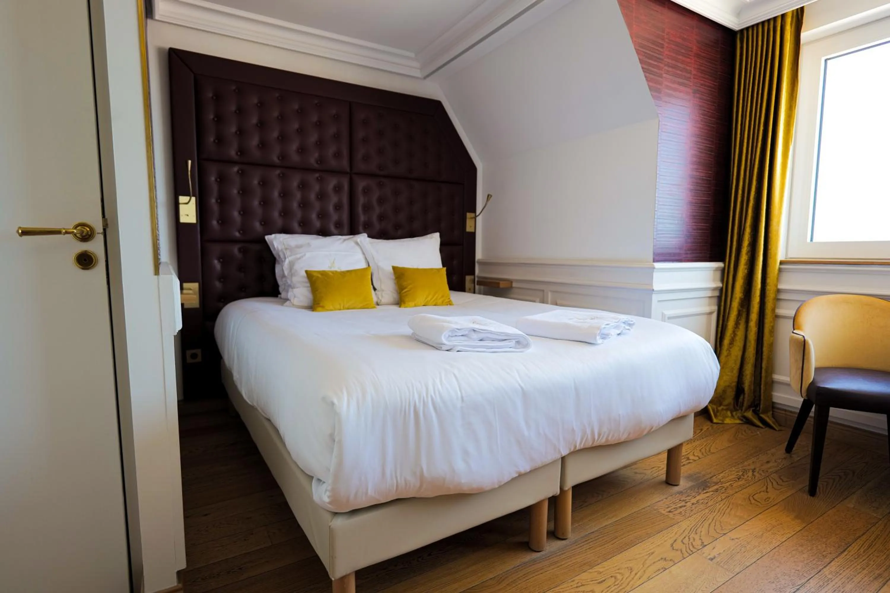 Bed in Hôtel Merveilleux Côté Mer