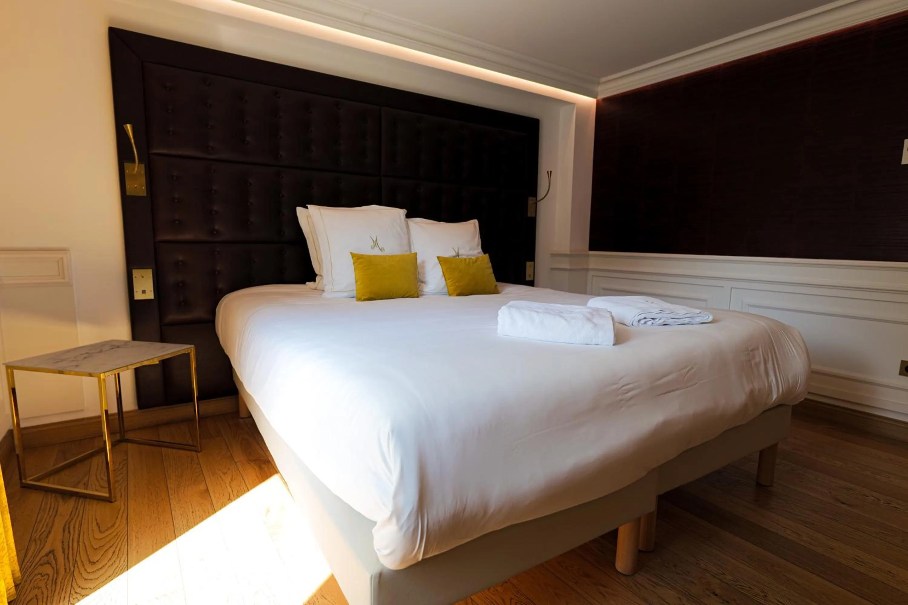 Bed in Hôtel Merveilleux Côté Mer