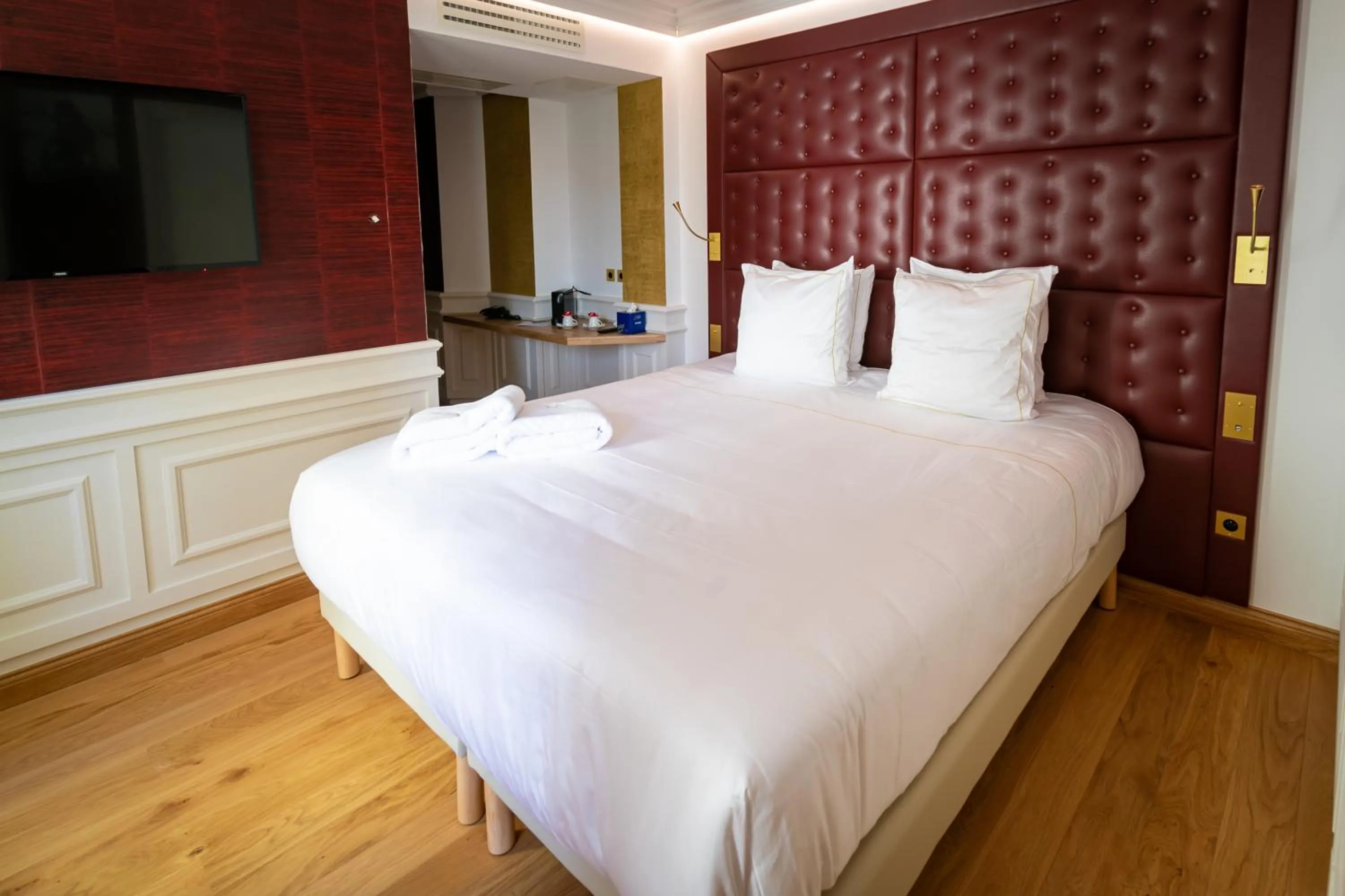 Bed in Hôtel Merveilleux Côté Mer