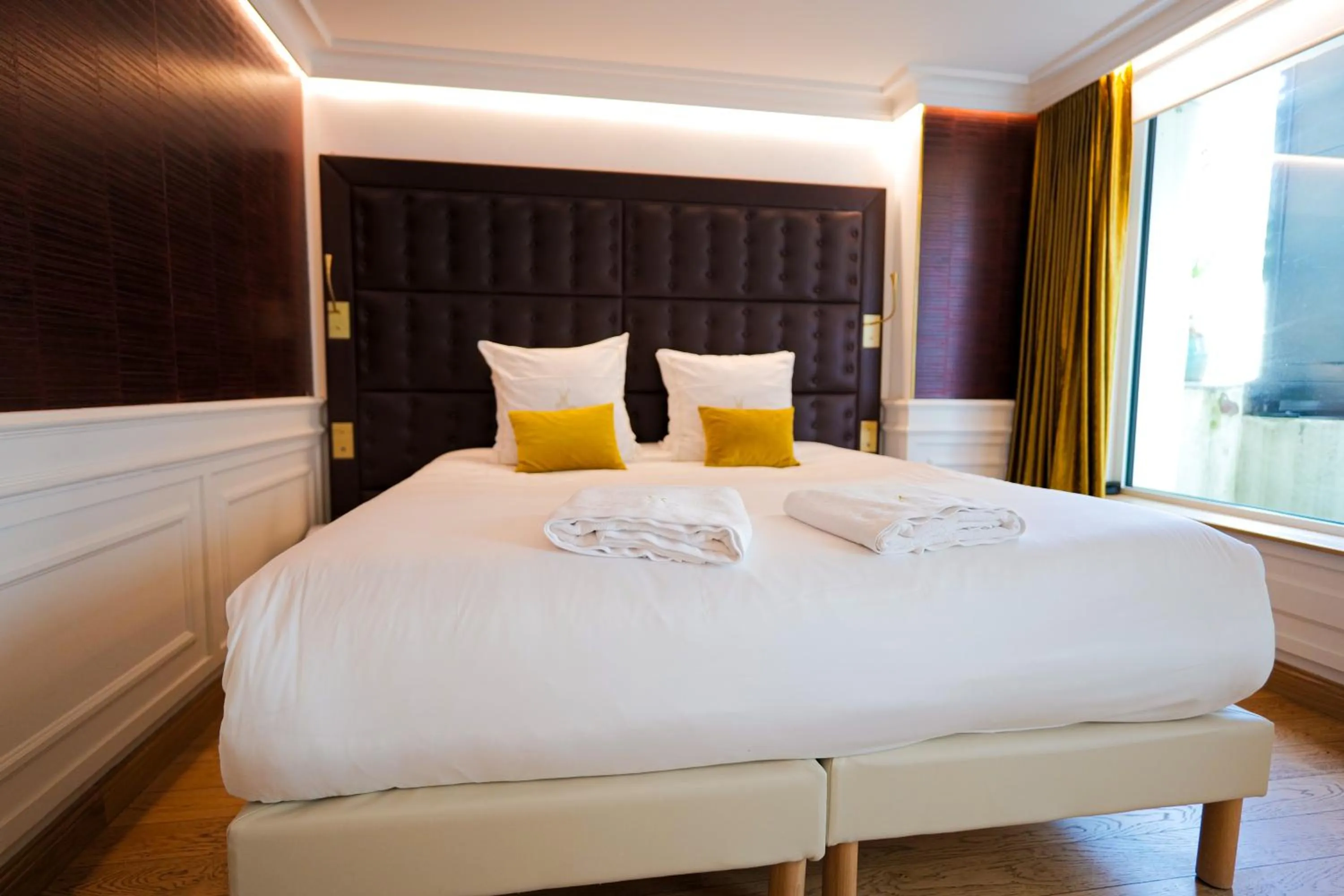 Bed in Hôtel Merveilleux Côté Mer