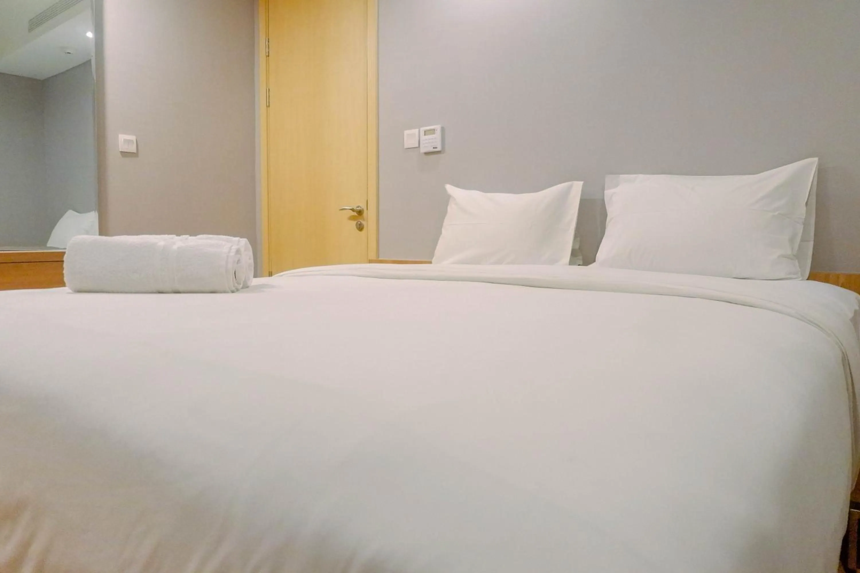 Bed in Luxurious & Spacious 2BR Apartment at One East Residences By Travelio