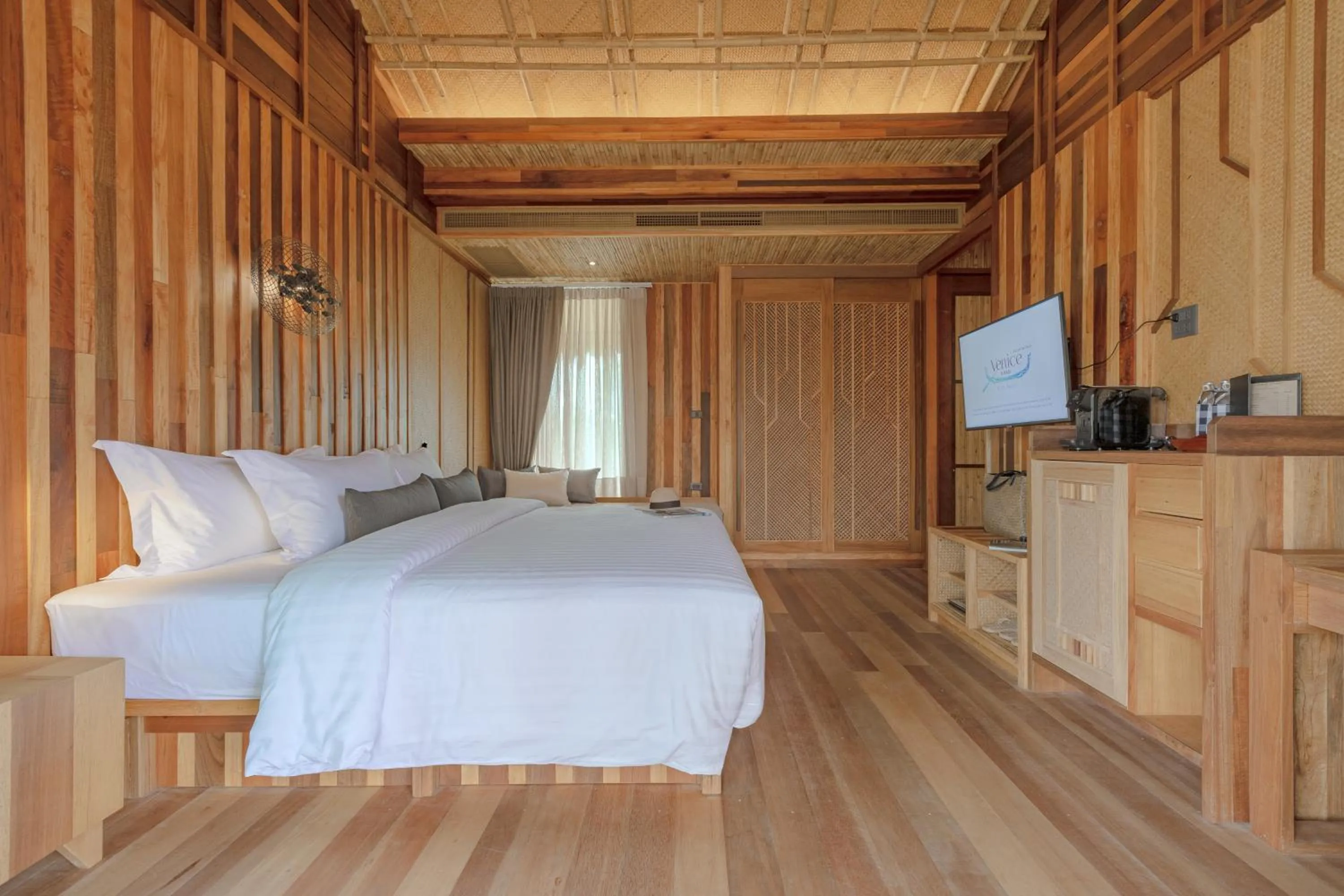 Communal lounge/ TV room, Bed in Venice Krabi Villa Resort