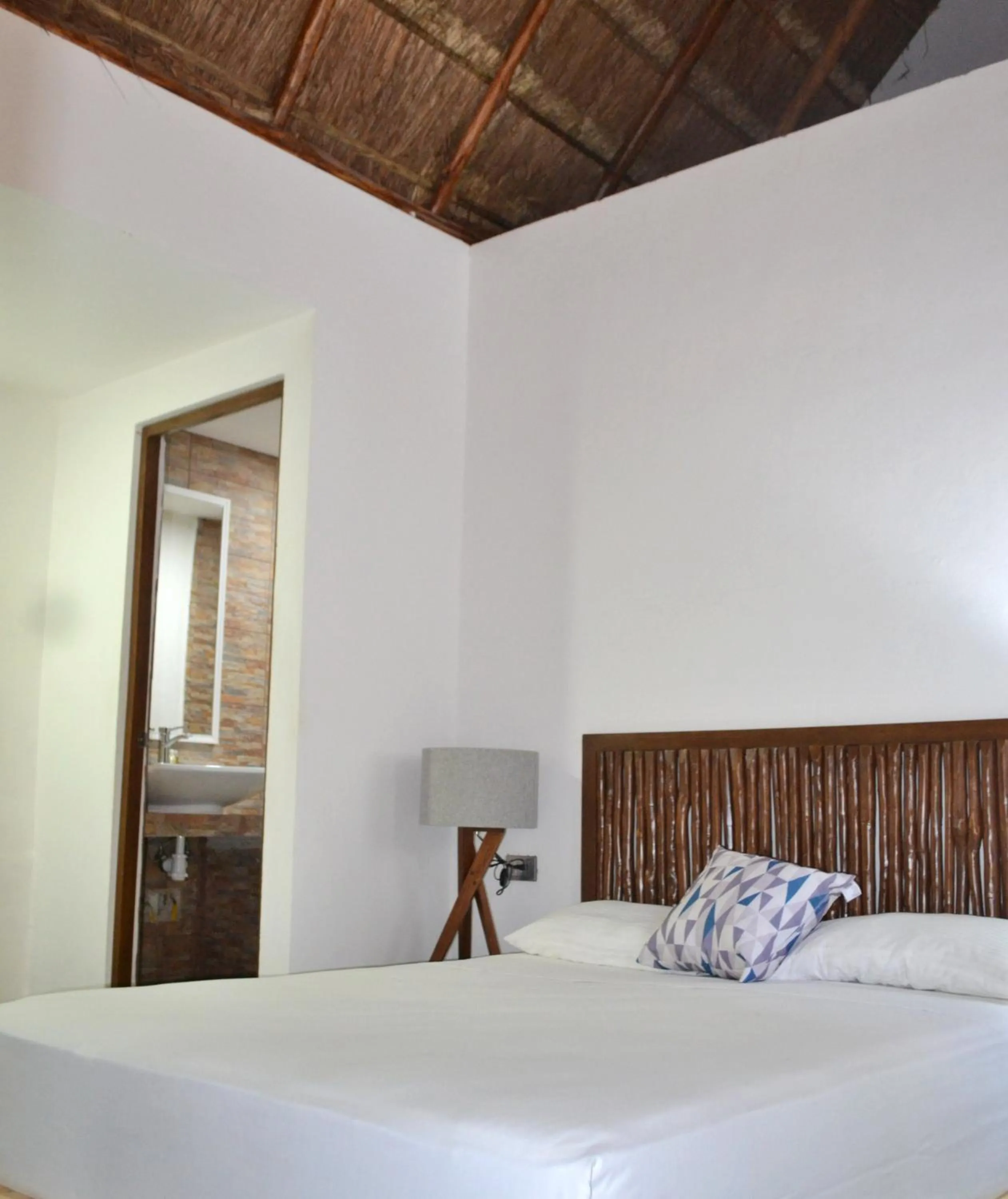 Photo of the whole room, Bed in Kinta Kan Cabañas Hotel Playa del Carmen