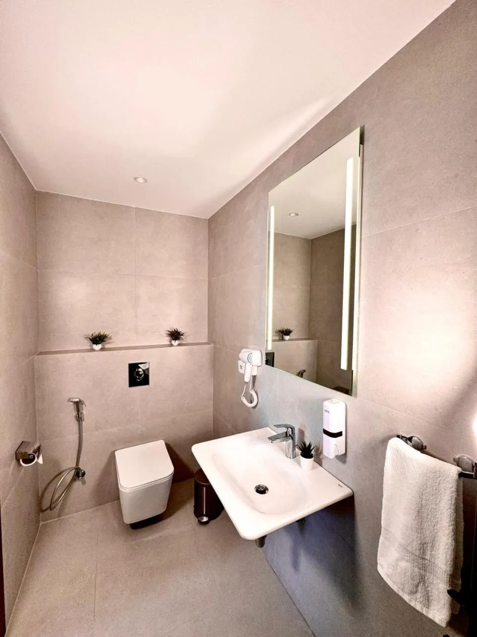 Bathroom in New MerryLand Hotel