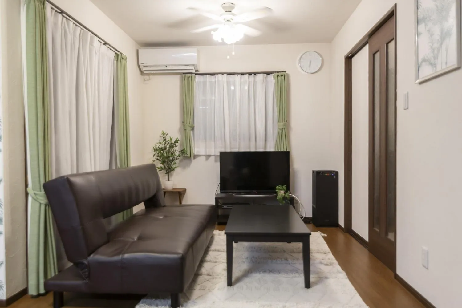 Communal lounge/ TV room in Ocean Front Maezato