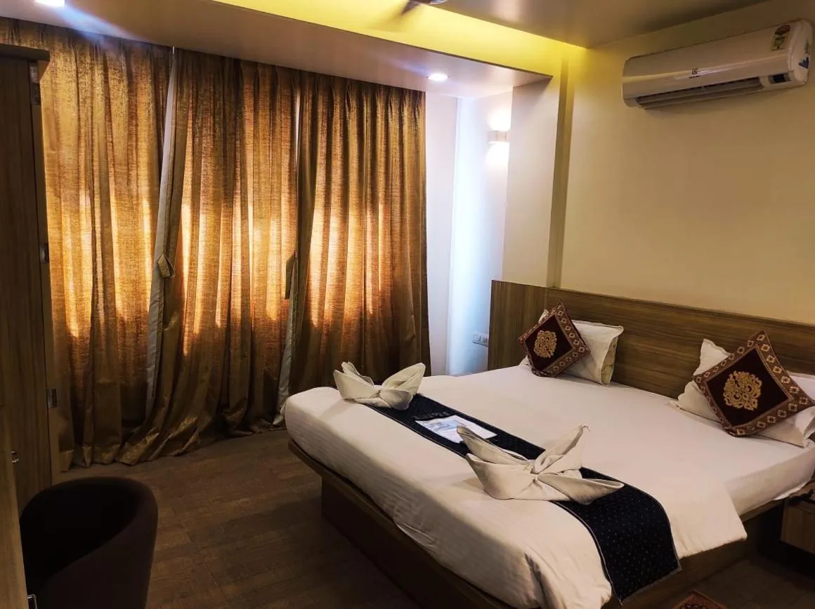 Bed in Hotel Manasi Royal