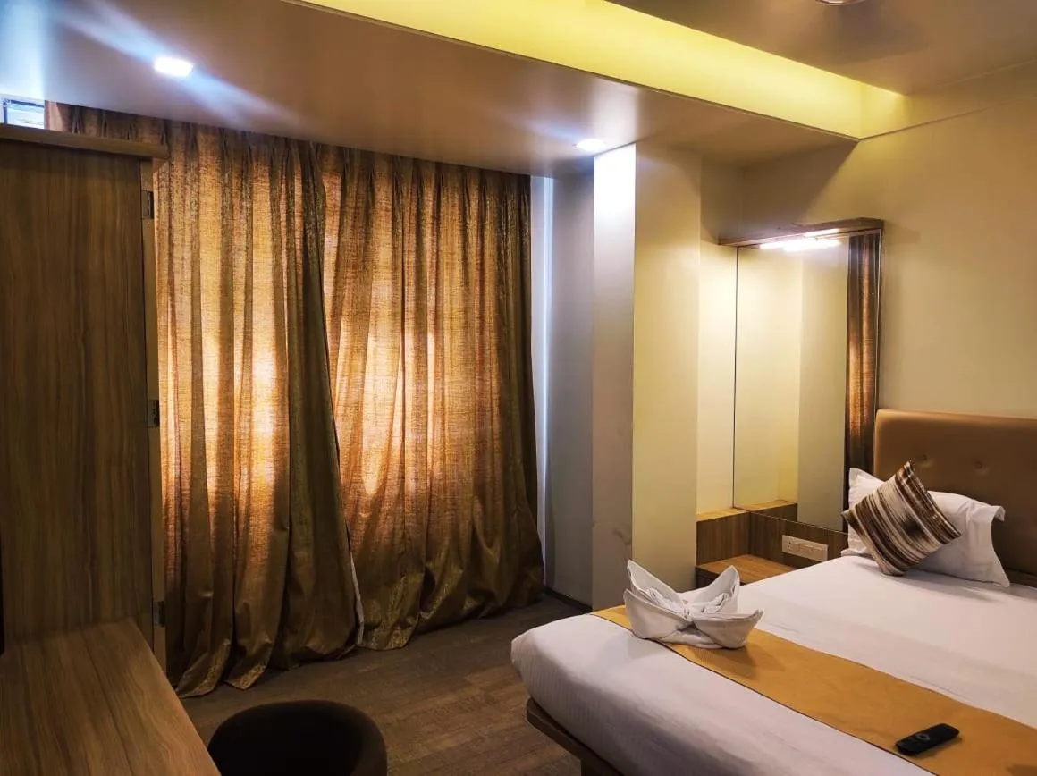 Bed in Hotel Manasi Royal