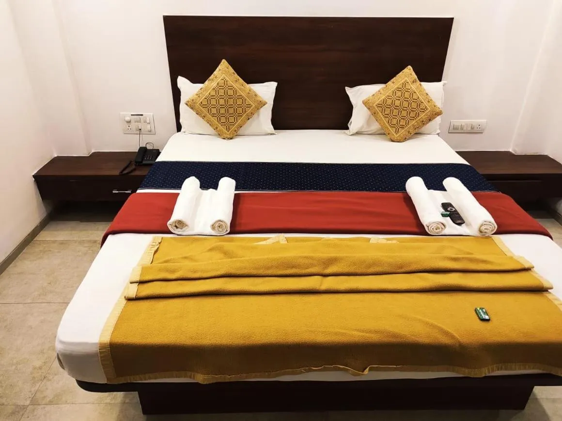 Bed in Hotel Manasi INN