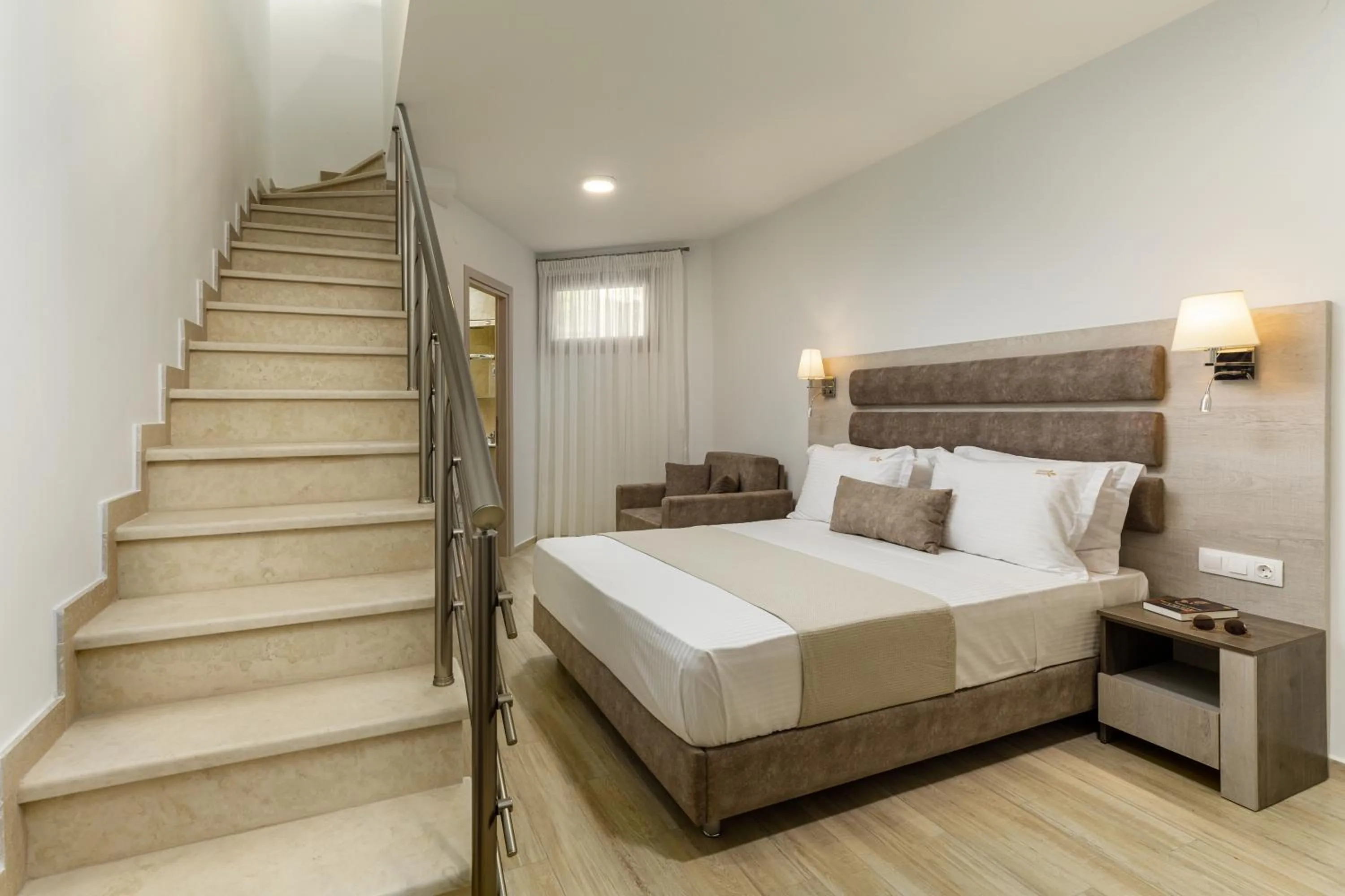 Bed in Aria Garden Suites