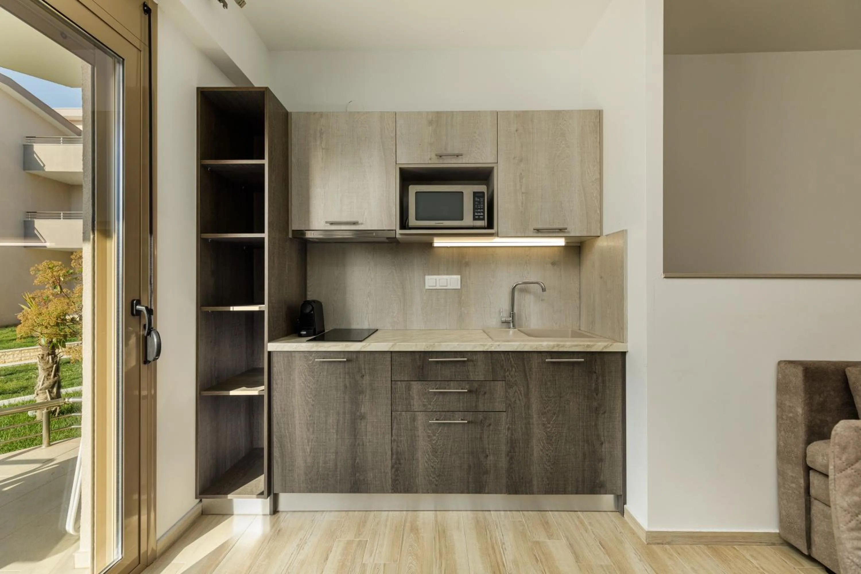 Kitchen or kitchenette in Aria Garden Suites