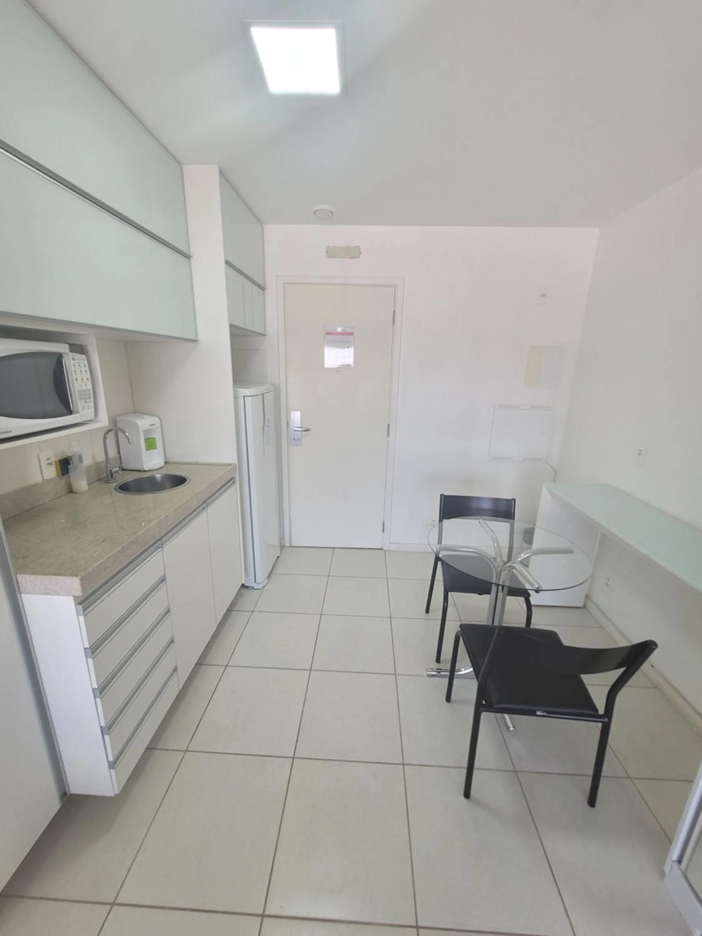 Kitchen or kitchenette in Flat Vision Executivo Premium By Rei dos Flats