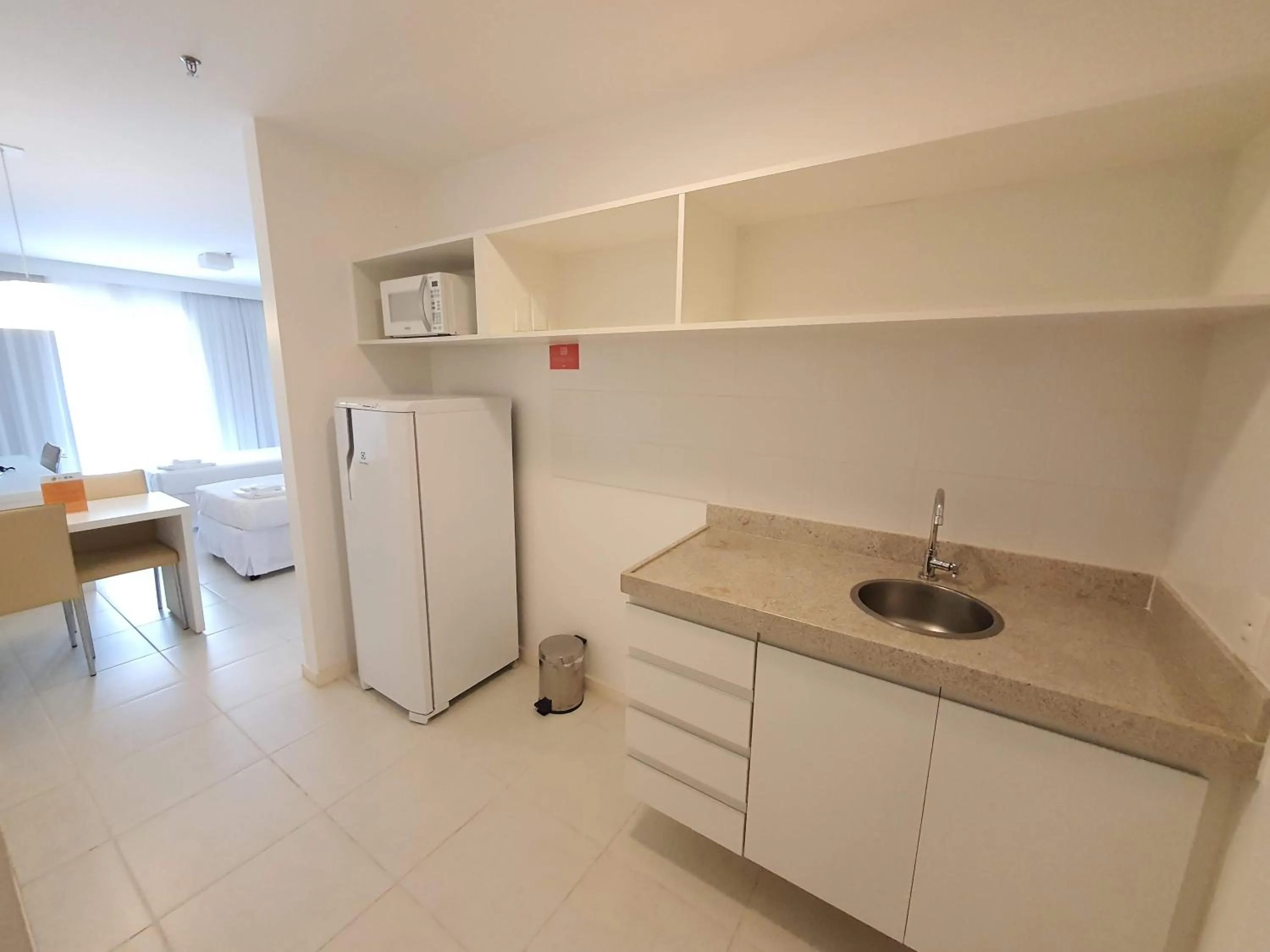 Kitchen or kitchenette in Flat Vision Executivo Premium By Rei dos Flats