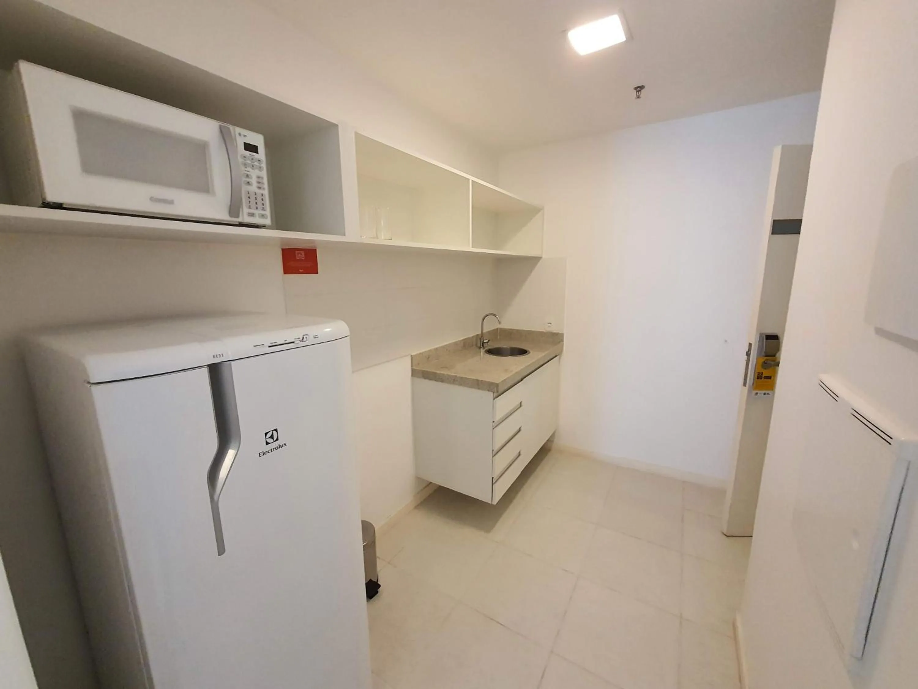 Kitchen or kitchenette in Flat Vision Executivo Premium By Rei dos Flats