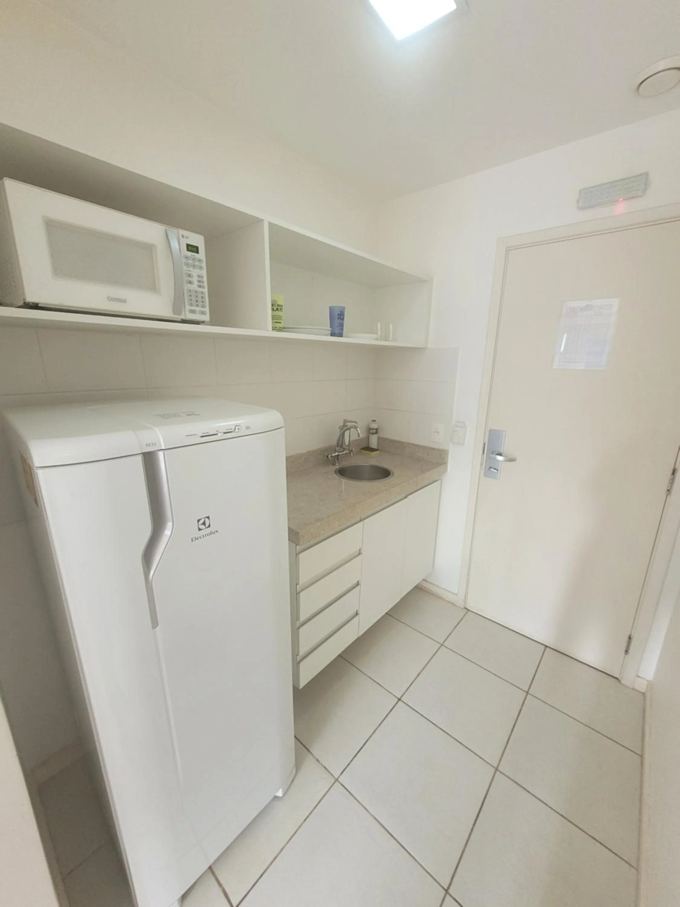 Kitchen or kitchenette in Flat Vision Executivo Premium By Rei dos Flats