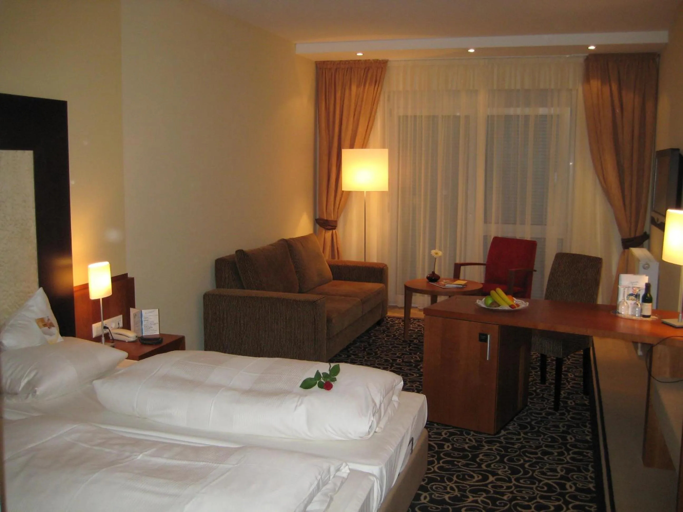 Communal lounge/ TV room, Bed in Ringhotel Bundschu