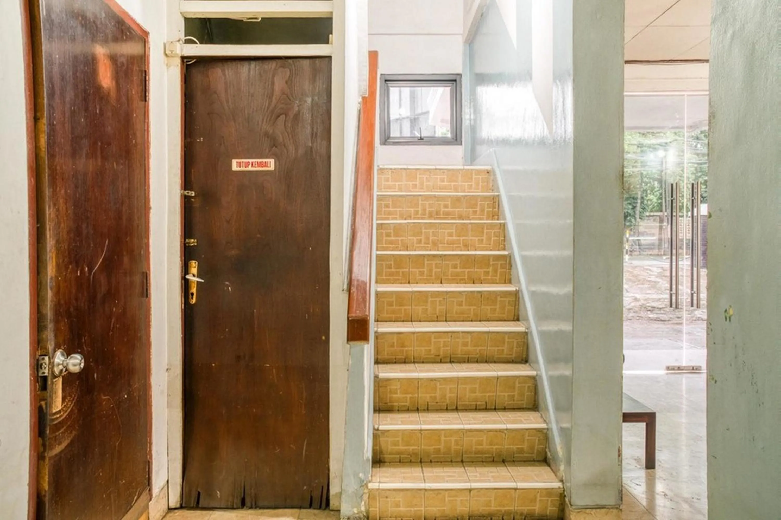 Facade/entrance in RedDoorz near Plaza Senayan