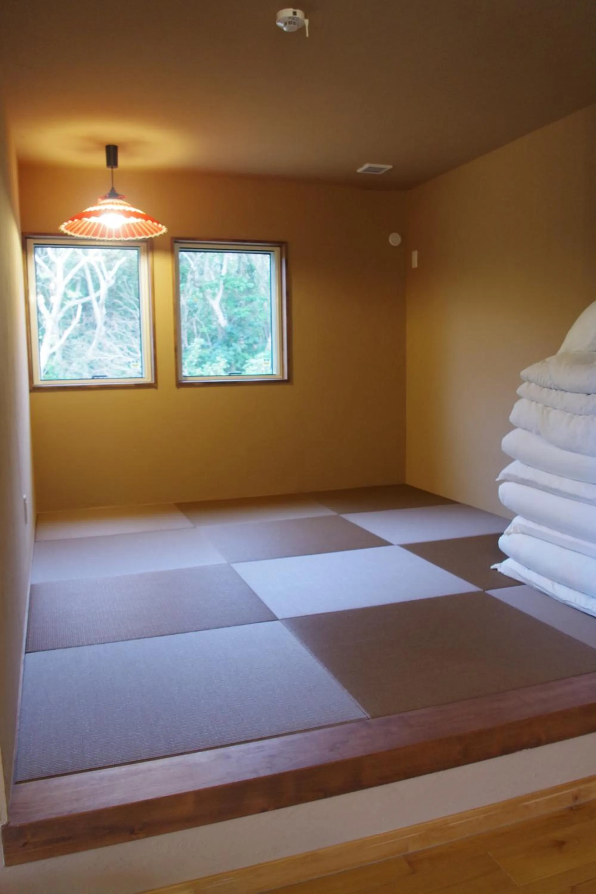 Bed in YOISAMA Sunset Beach House