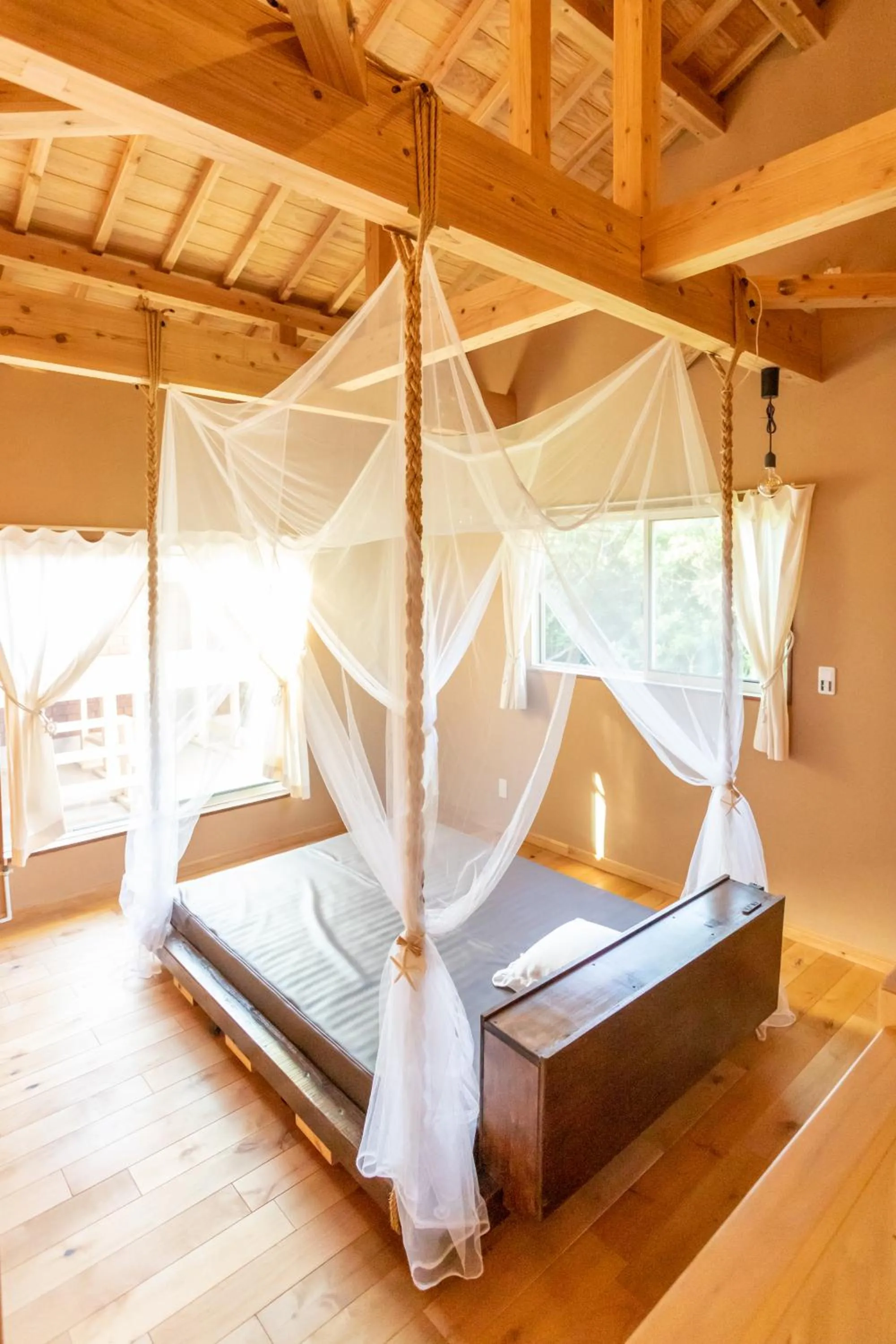 Bed in YOISAMA Sunset Beach House