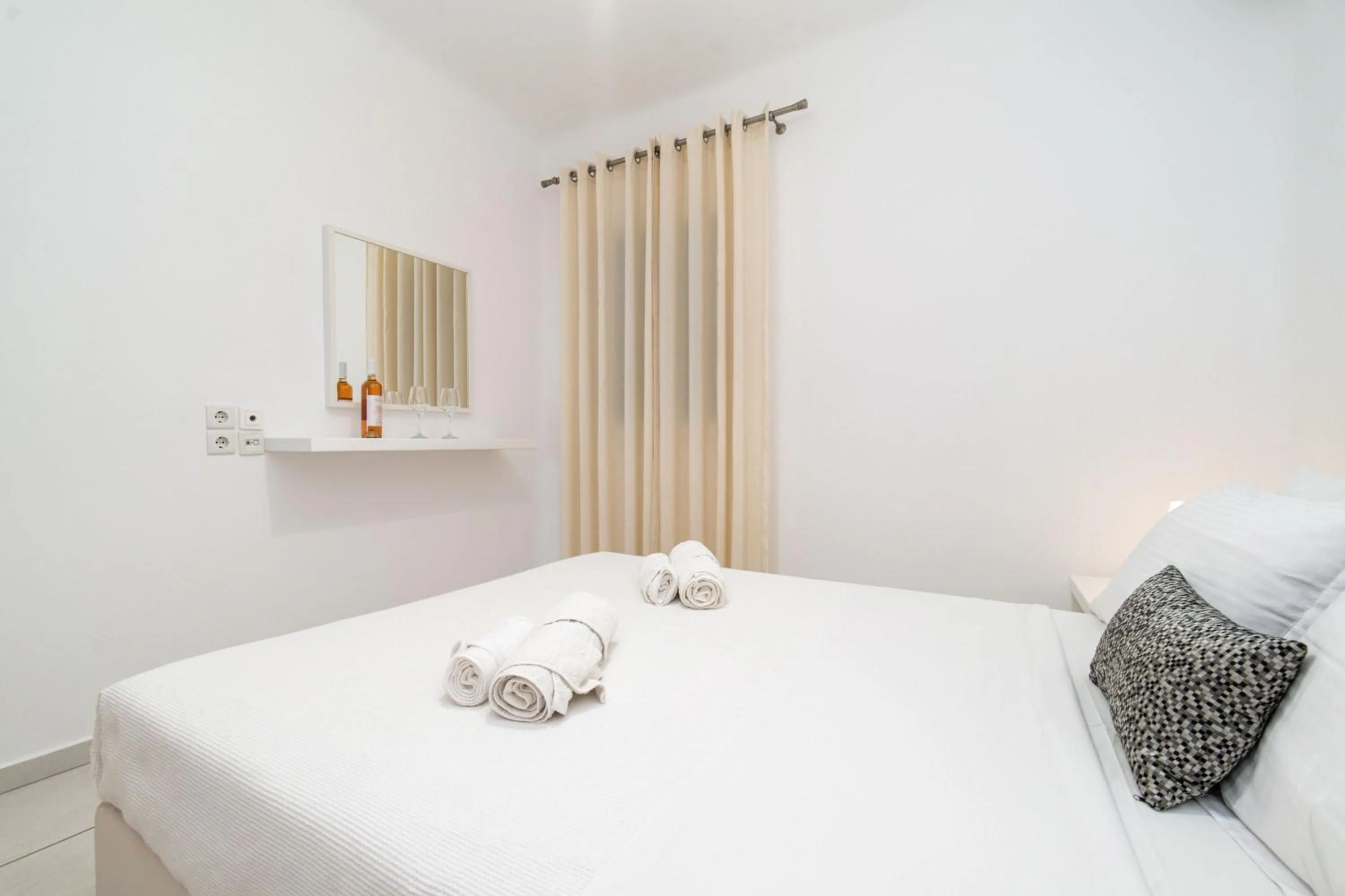 Bed in Overview Mykonos Apartments