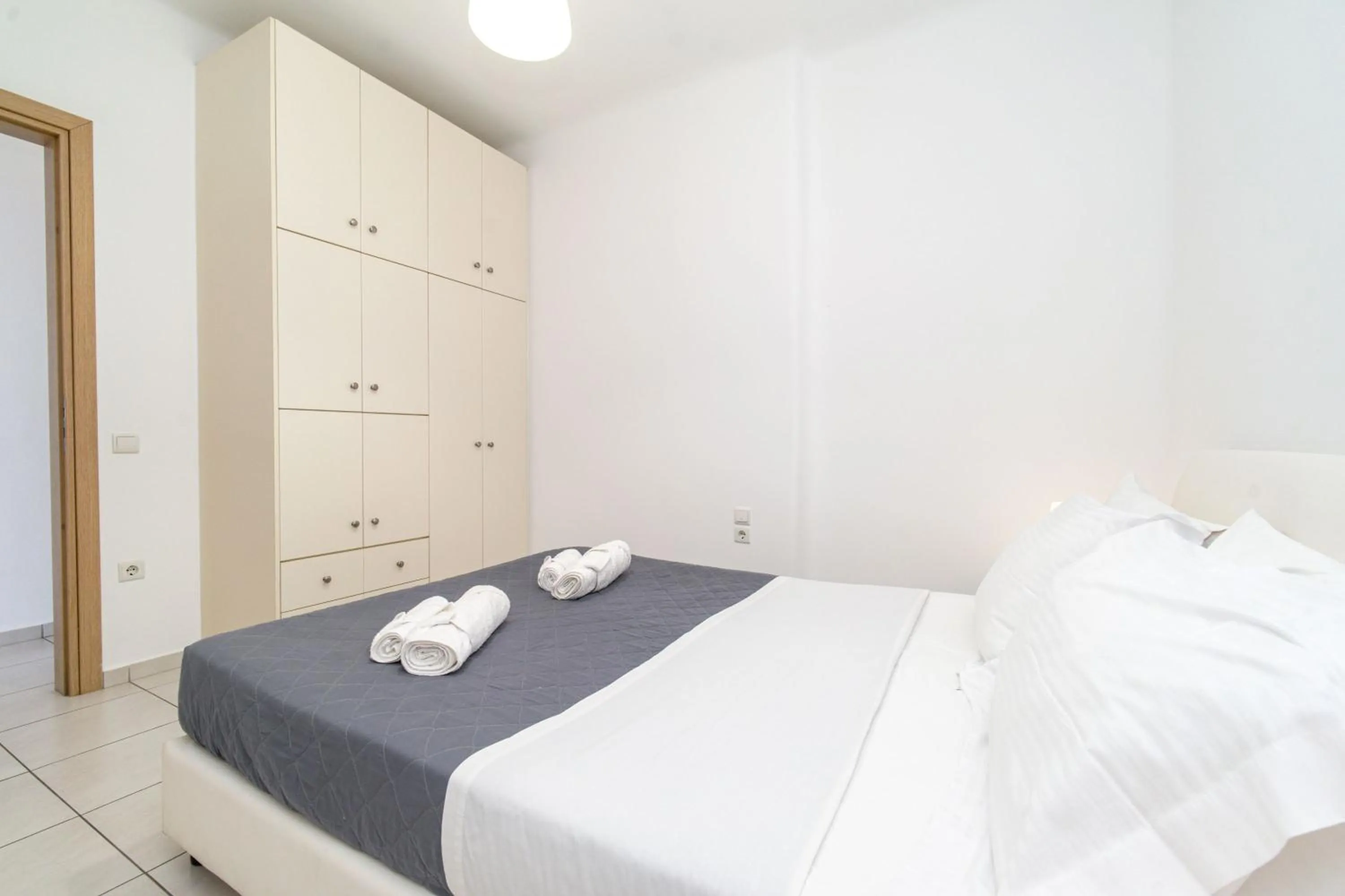 Bed in Overview Mykonos Apartments