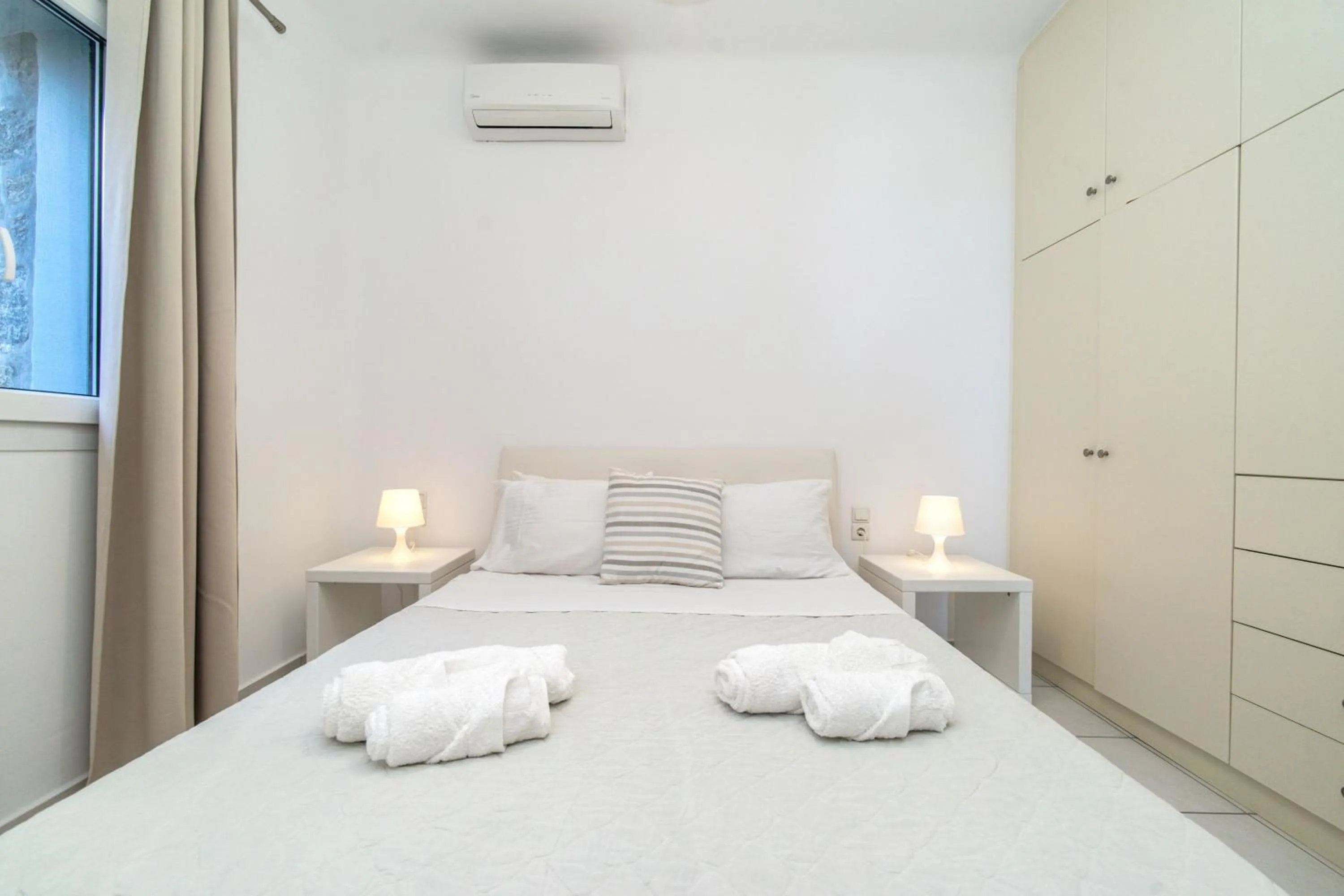 Bed in Overview Mykonos Apartments