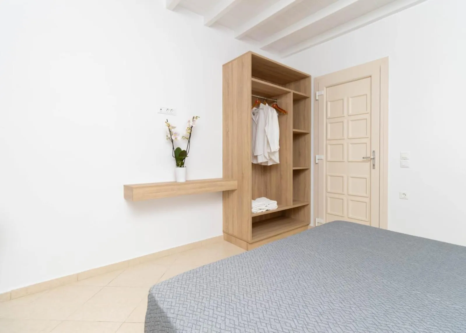 Bed in Overview Mykonos Apartments