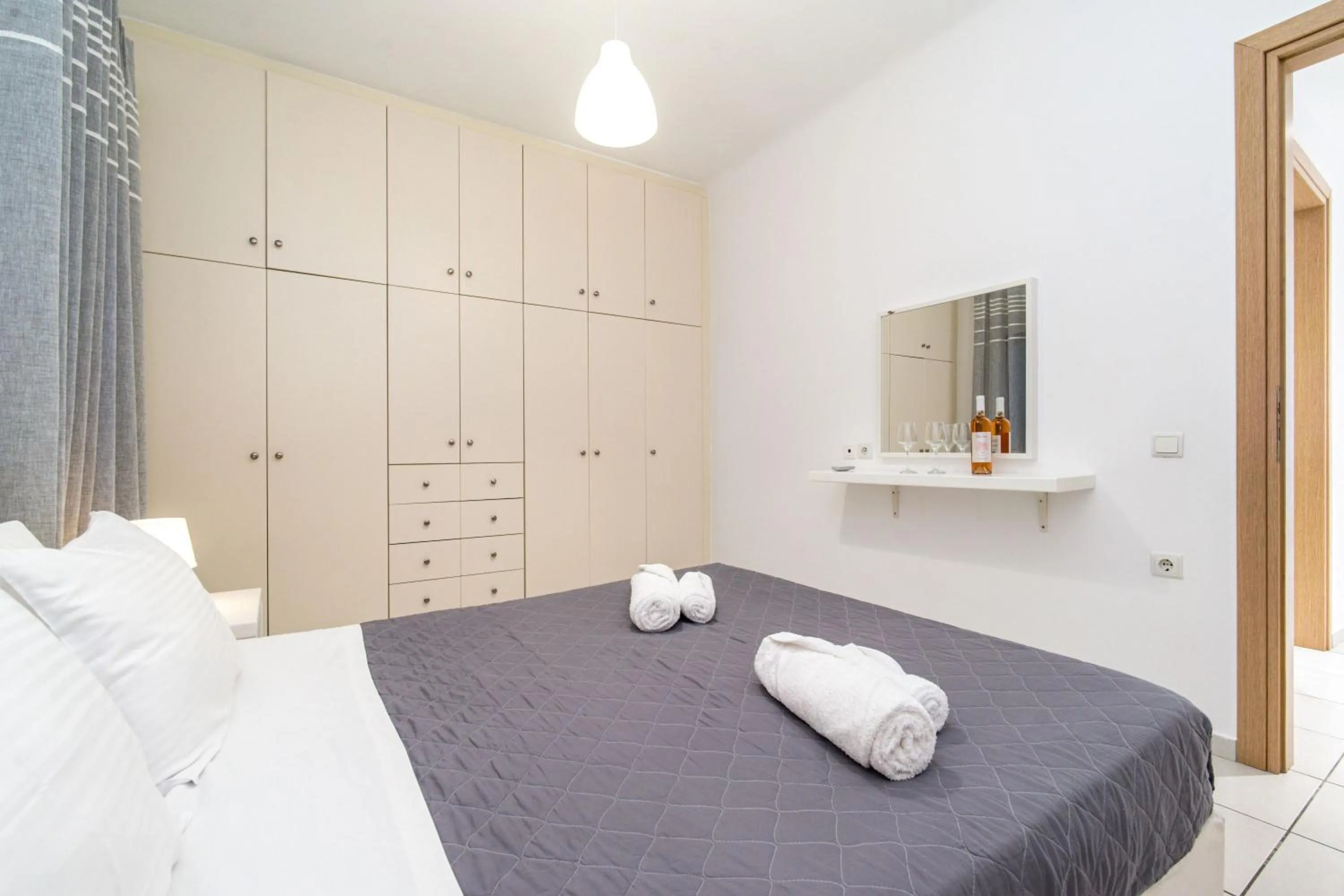 Bed in Overview Mykonos Apartments