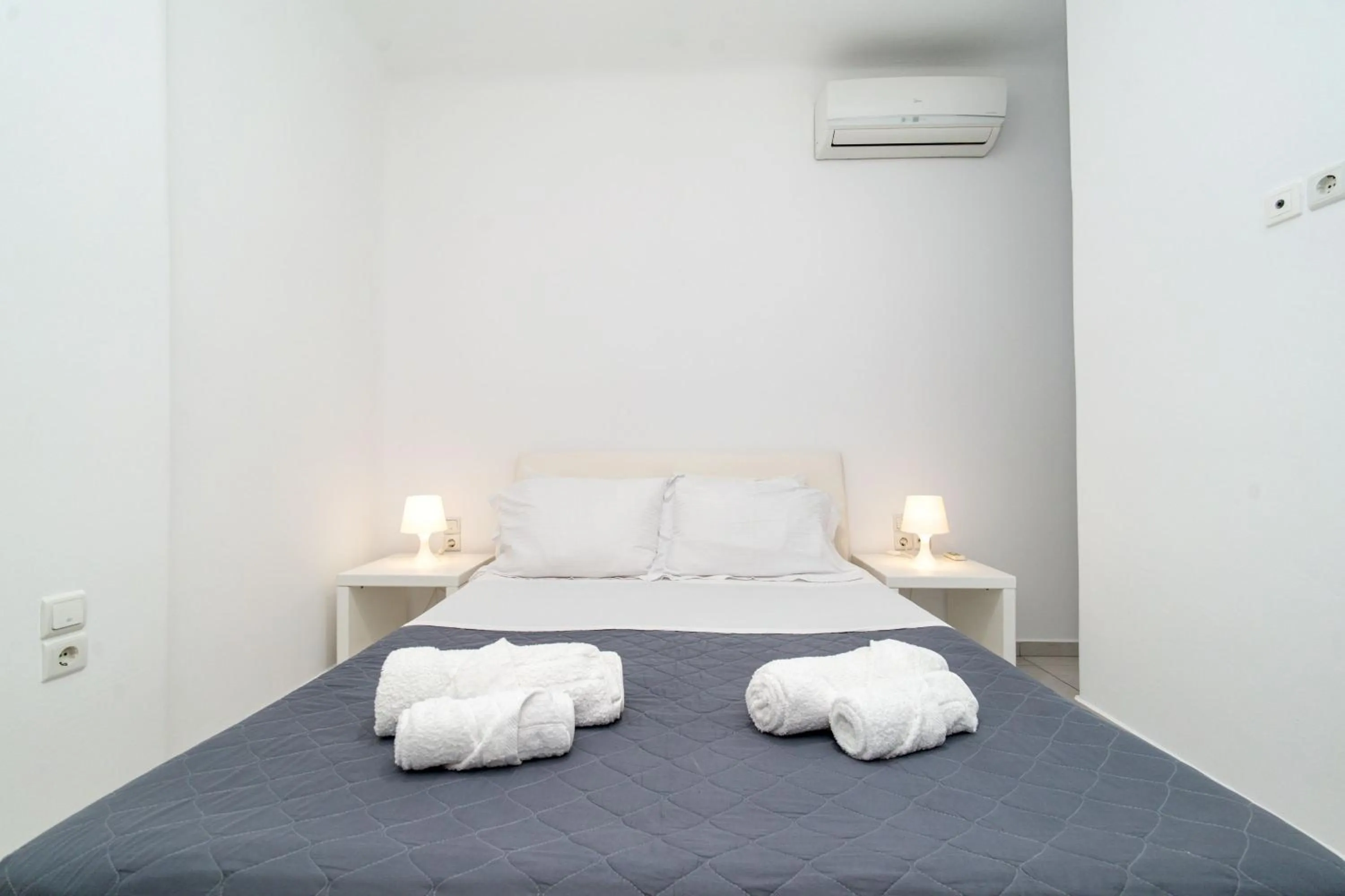 Bed in Overview Mykonos Apartments