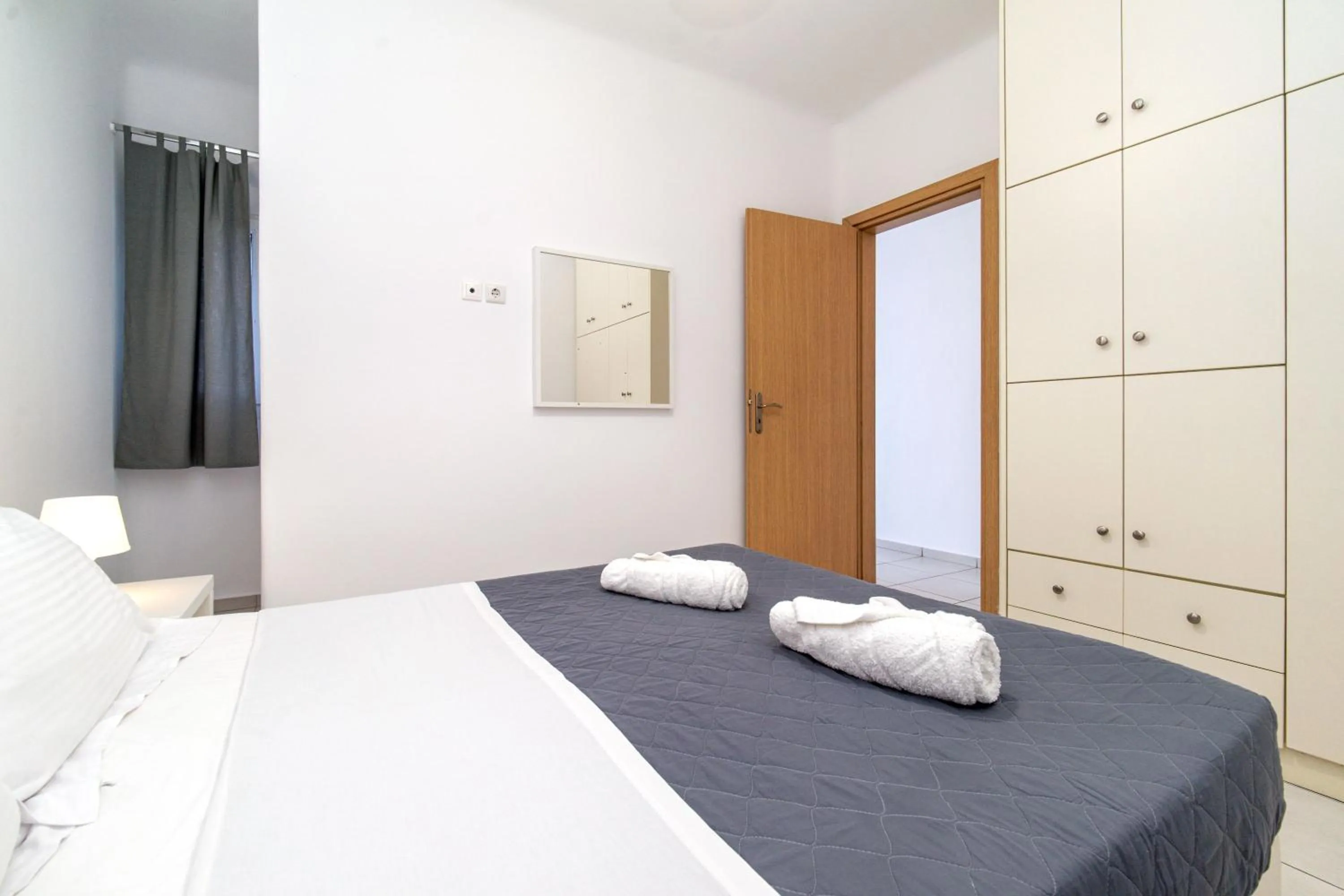 Bed in Overview Mykonos Apartments