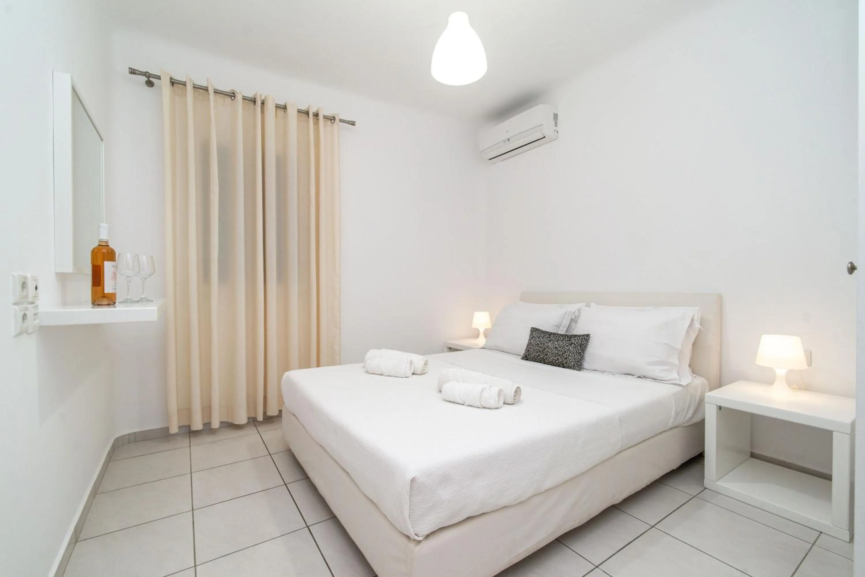 Bed in Overview Mykonos Apartments