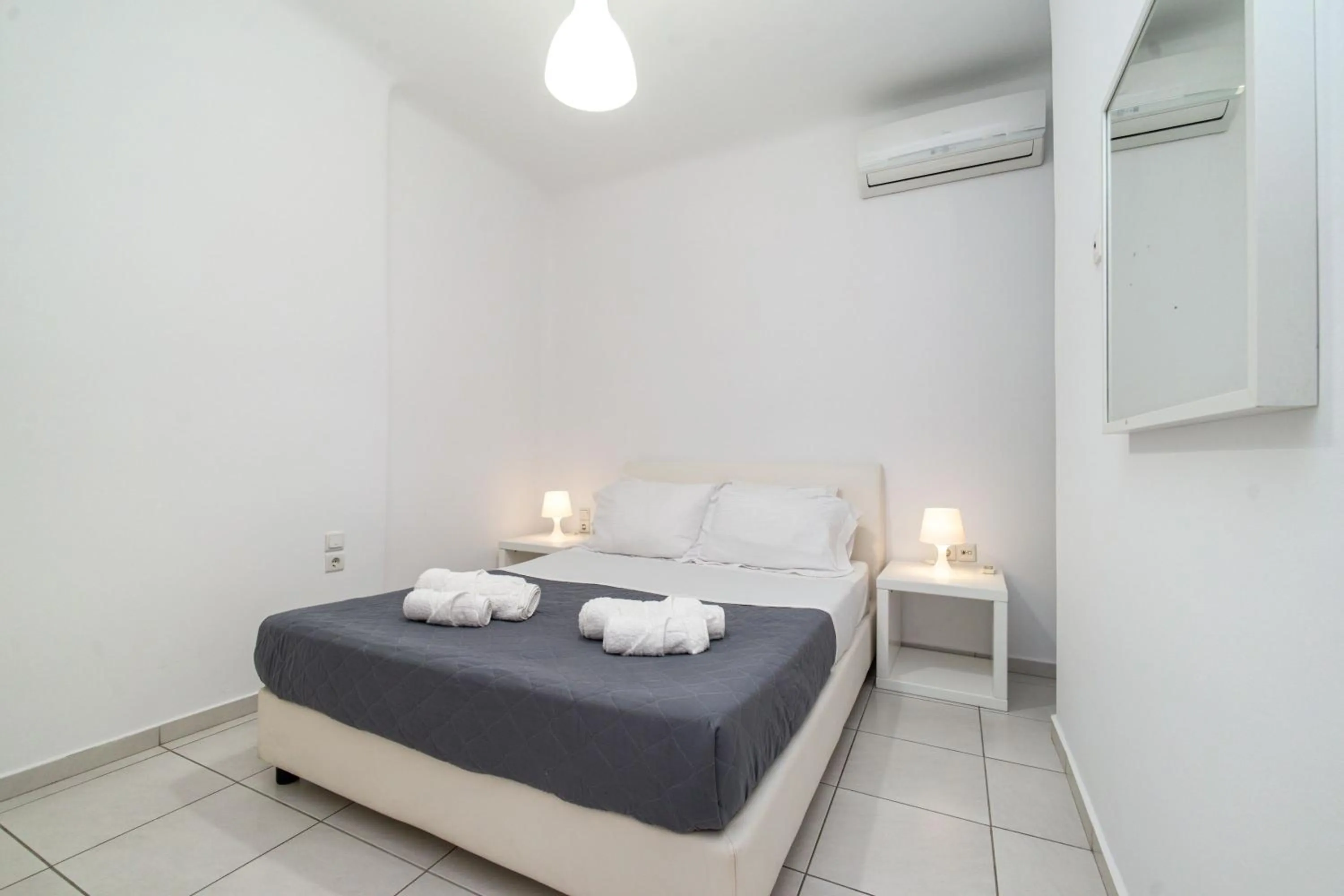 Bed in Overview Mykonos Apartments