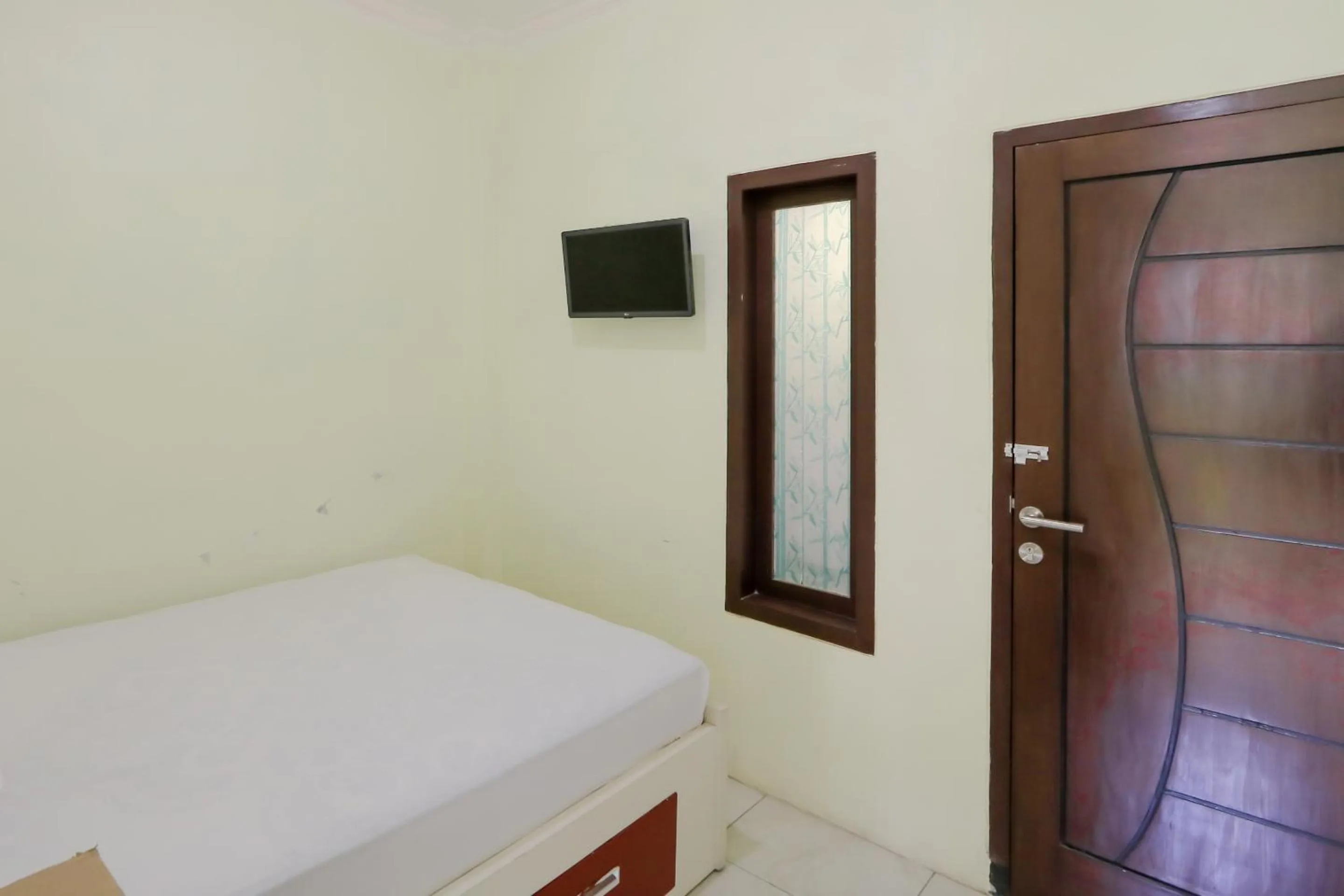 Bed in Zulfina Homestay Syariah Mitra RedDoorz