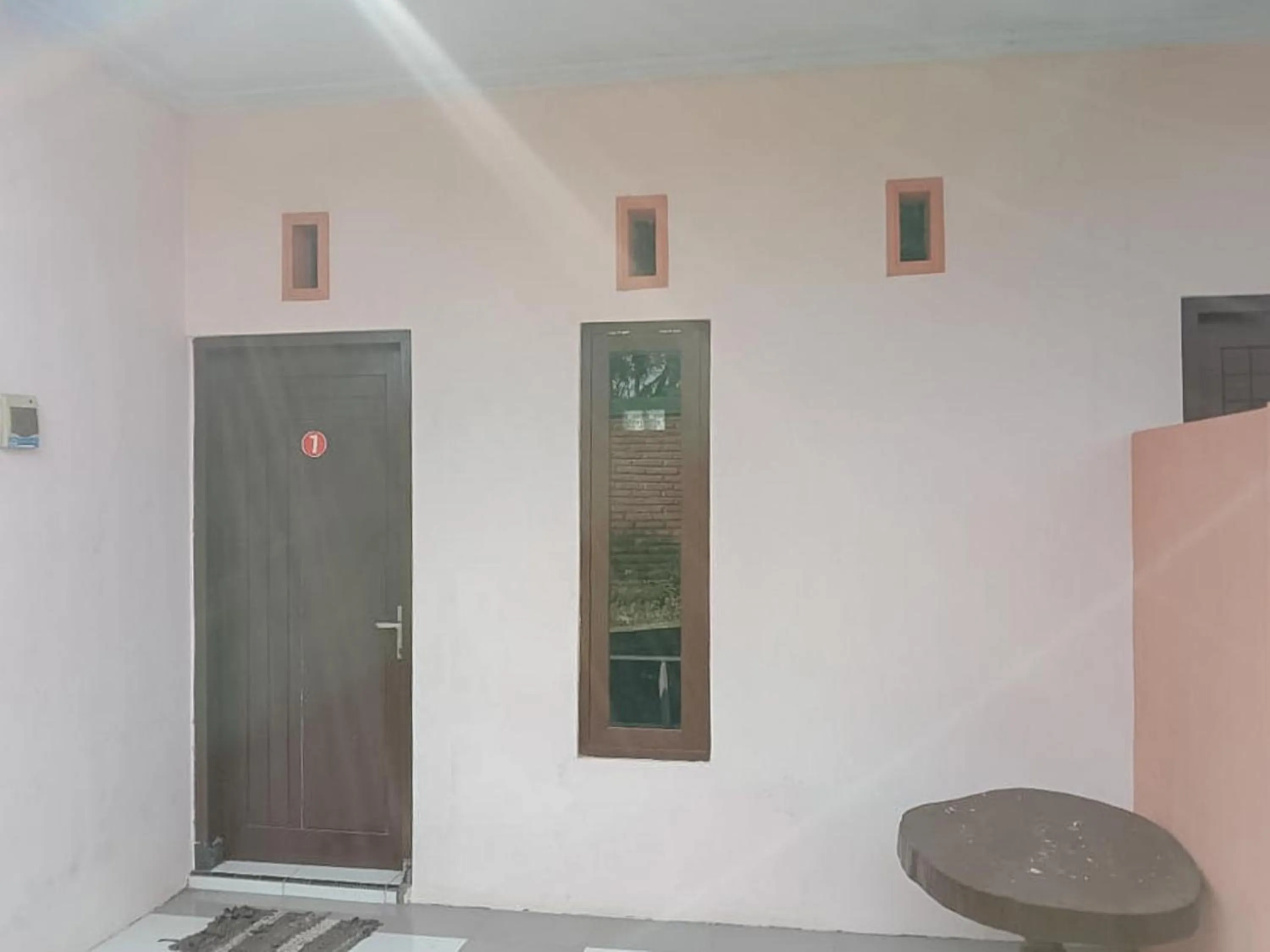 Facade/entrance in Zulfina Homestay Syariah Mitra RedDoorz