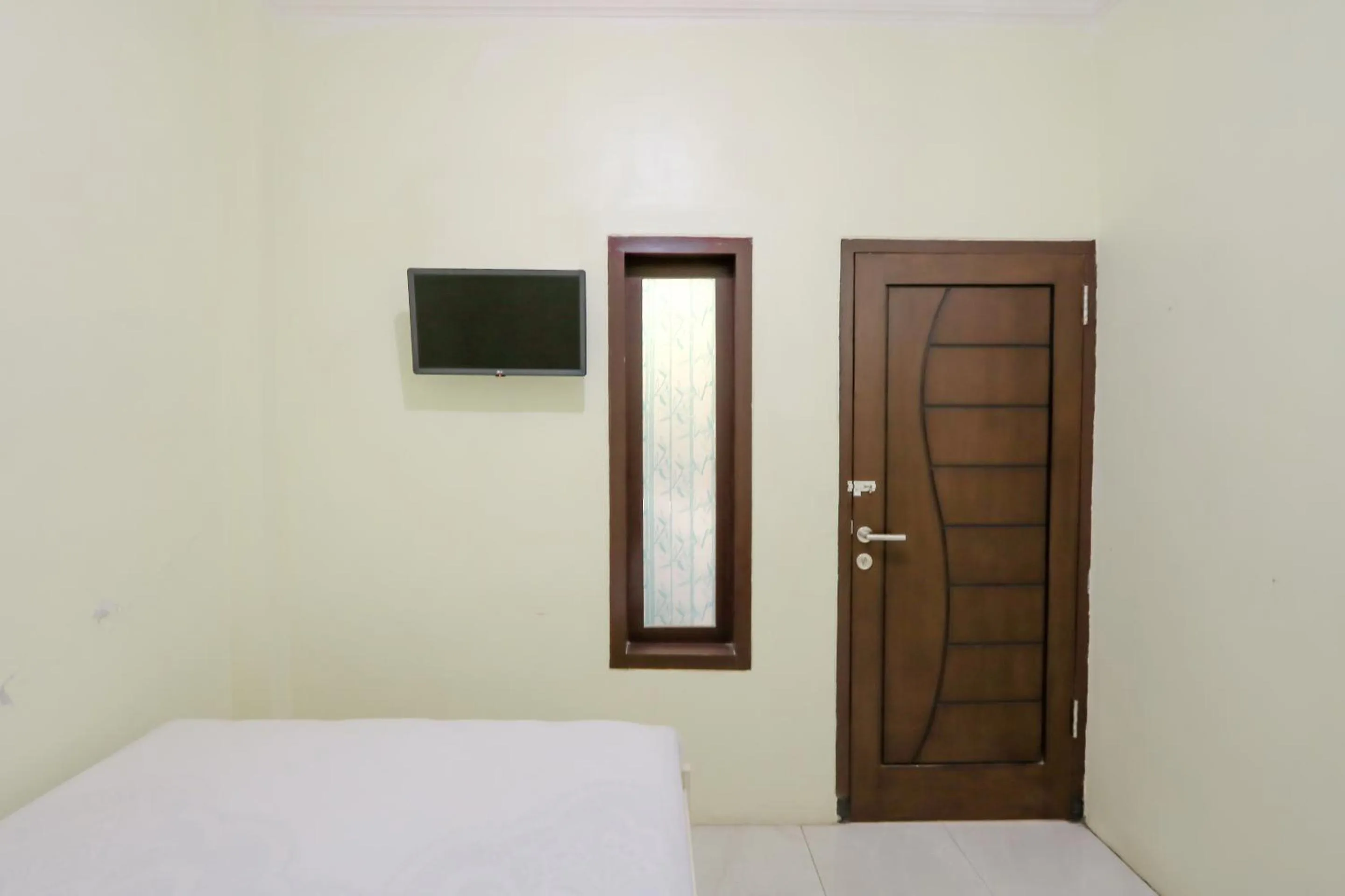 Bed in Zulfina Homestay Syariah Mitra RedDoorz