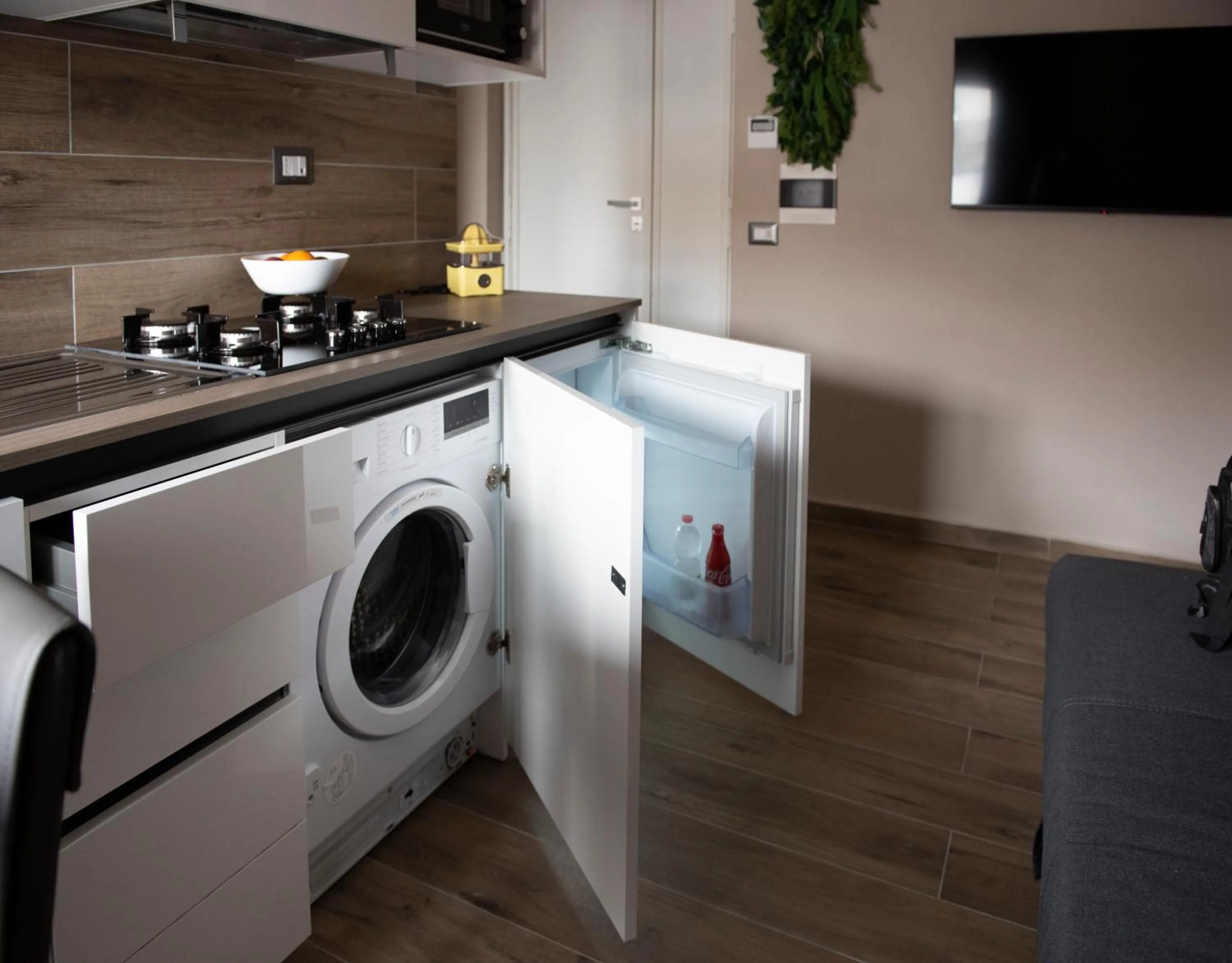 Kitchen or kitchenette in Famalu apartments