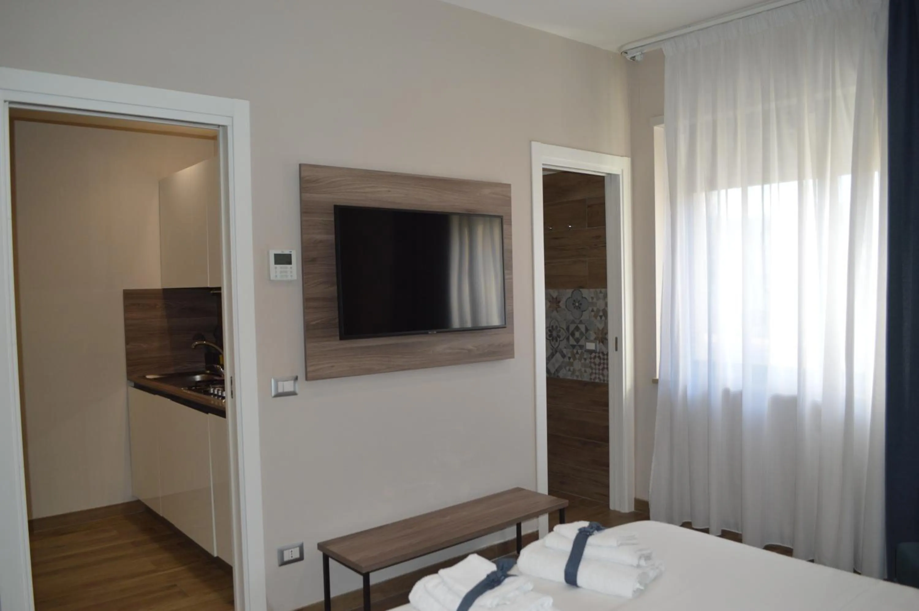 TV and multimedia, Bed in Famalu apartments