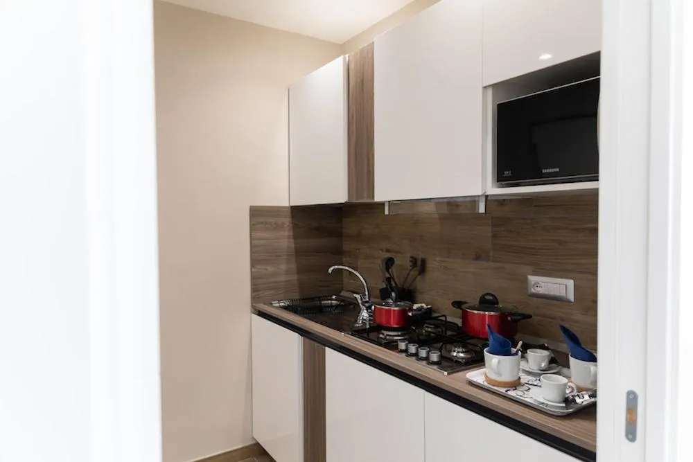 Kitchen or kitchenette in Famalu apartments