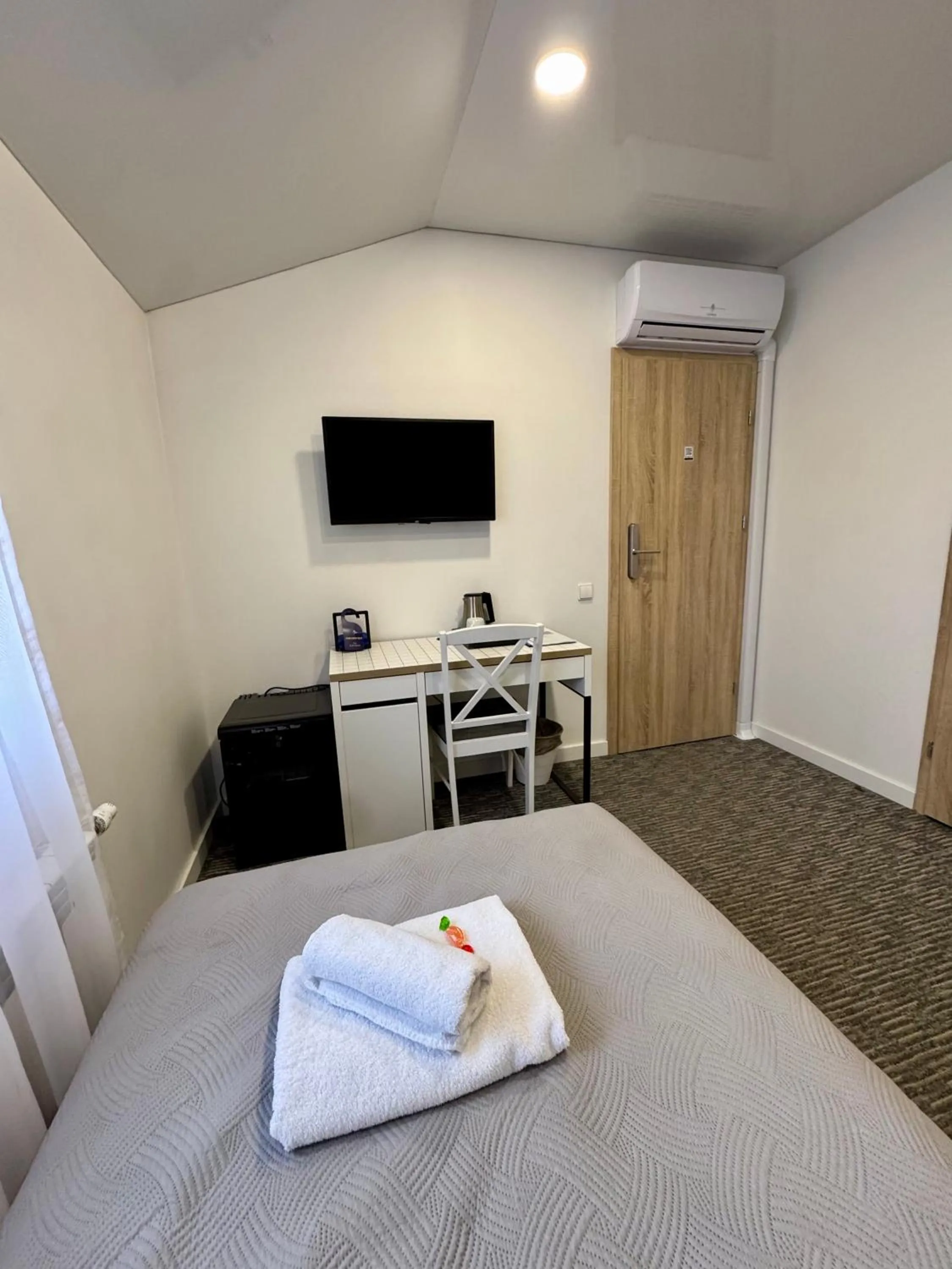 TV and multimedia, Bed in Grey apartments "Easy Kaunas"