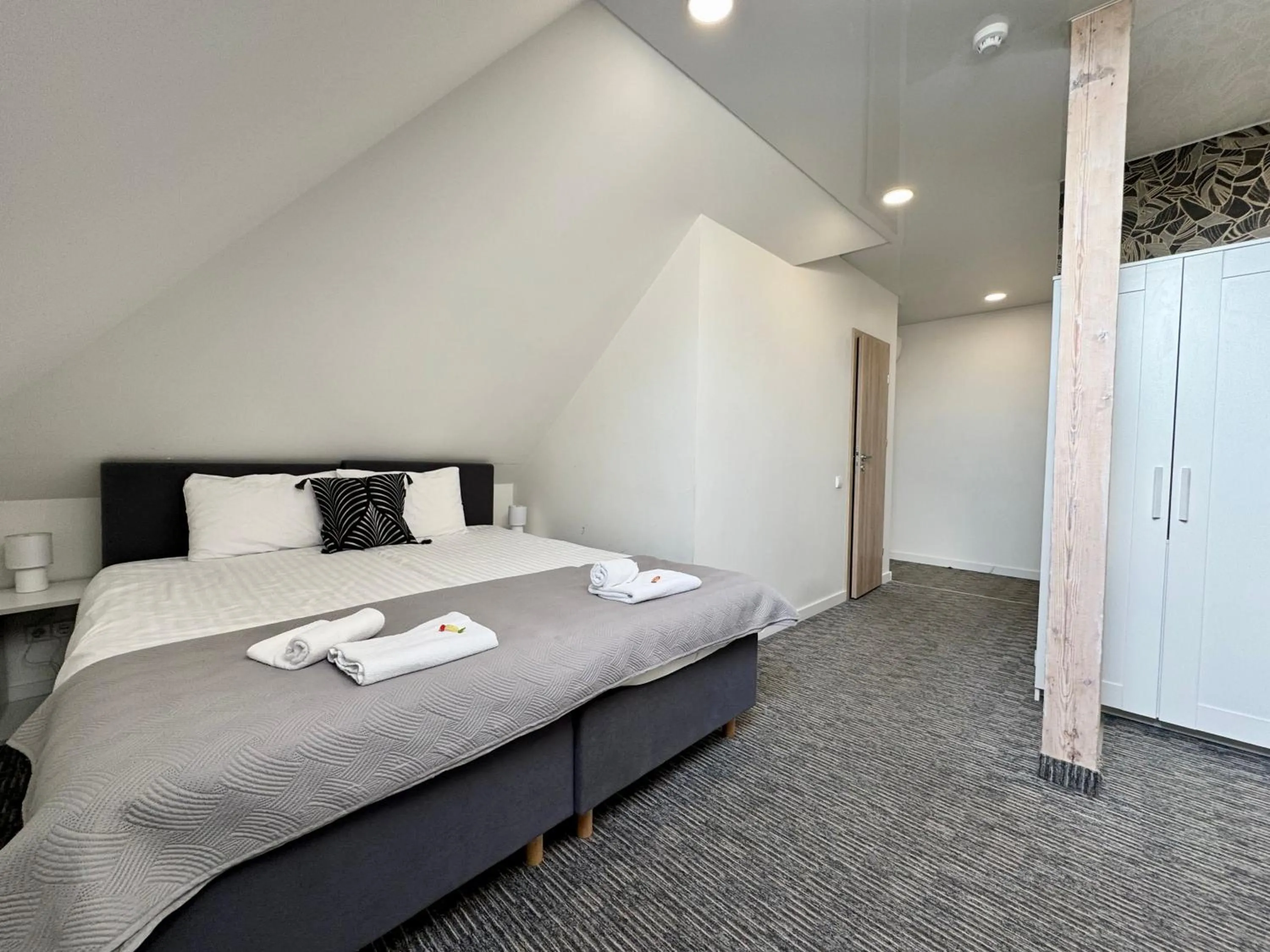 Bed in Grey apartments "Easy Kaunas"