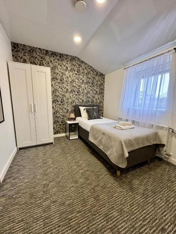 Bed in Grey apartments "Easy Kaunas"