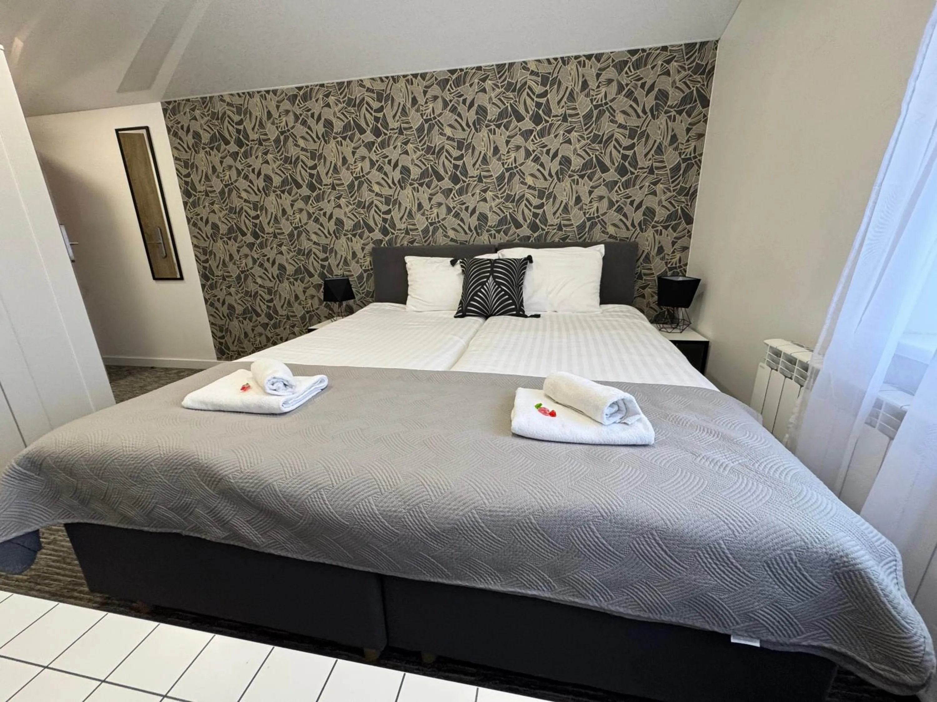 Bed in Grey apartments "Easy Kaunas"