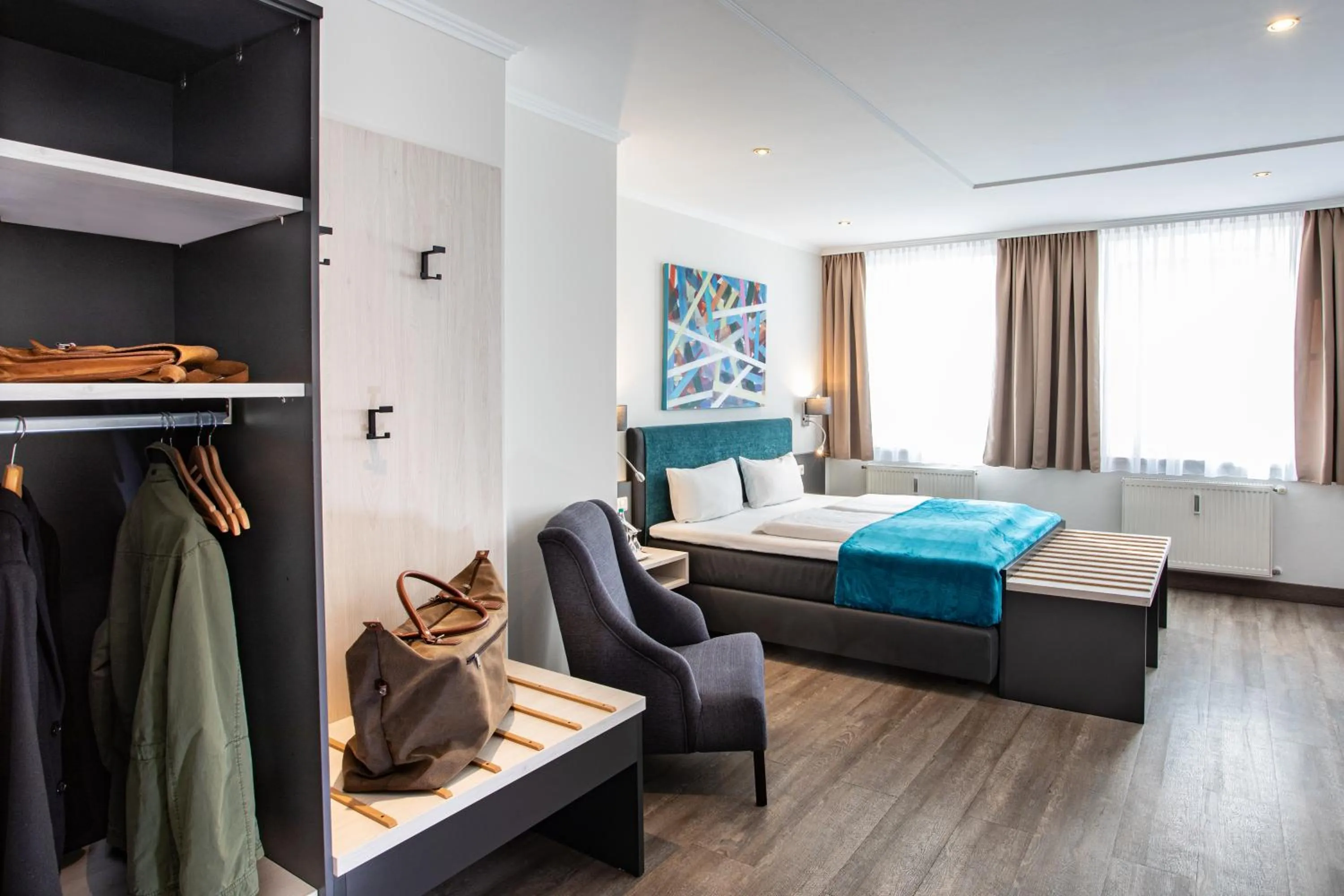 Seating area, Bed in Boardinghouse Hotel Münchner Hof Pfarrkirchen