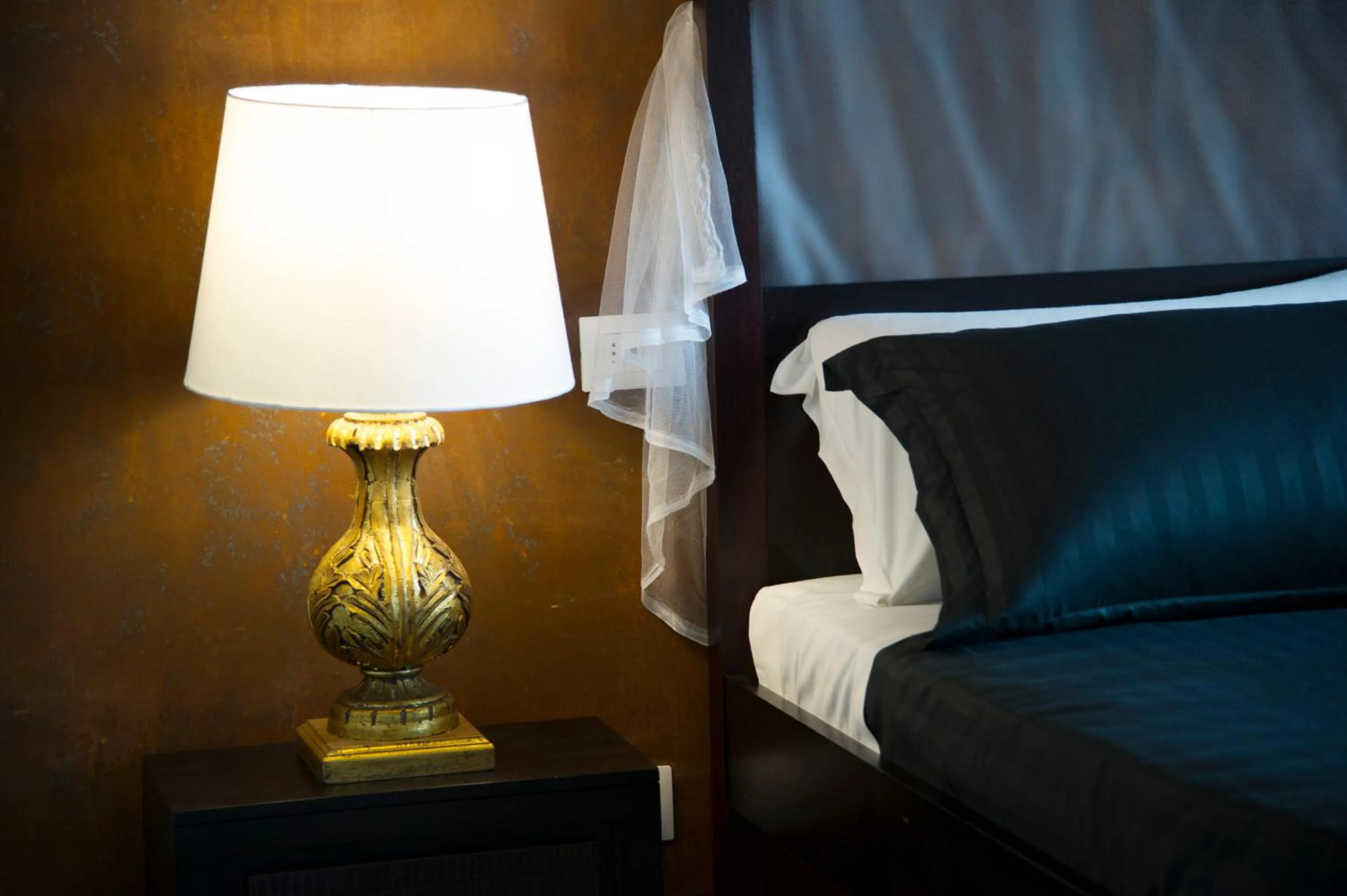 Bed in Le Boutique Luxury Rooms diffused in Historic Center