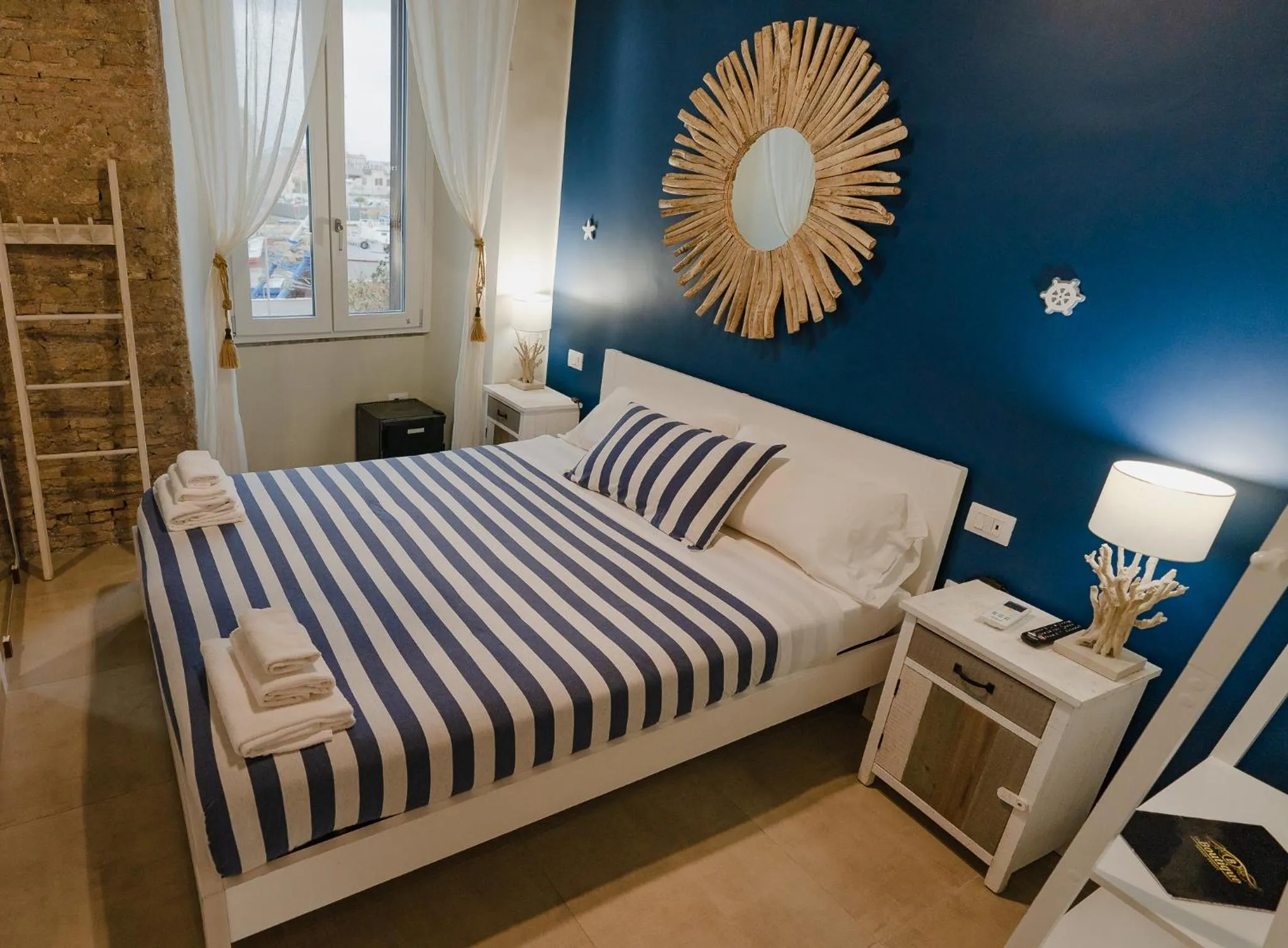 Bed in Le Boutique Luxury Rooms diffused in Historic Center