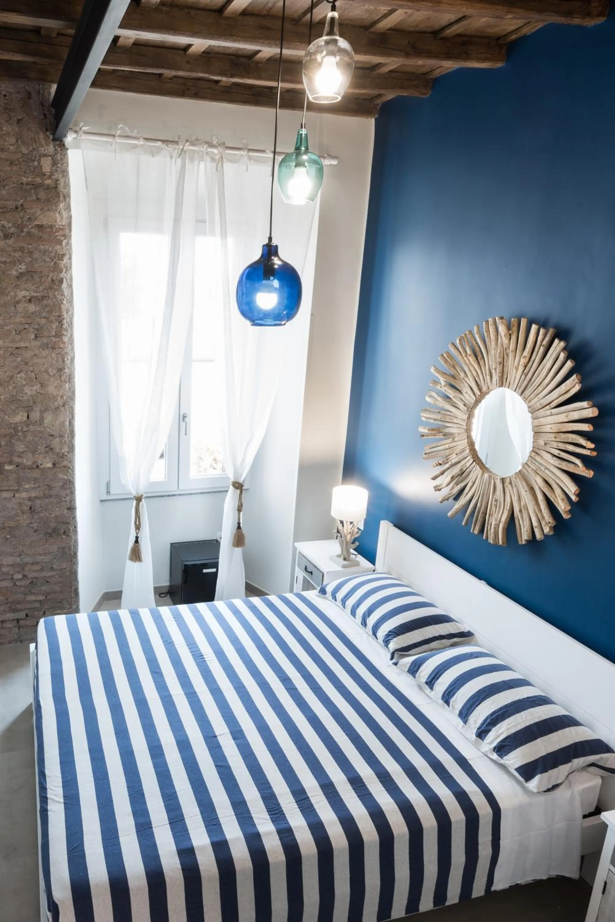 Bed in Le Boutique Luxury Rooms diffused in Historic Center