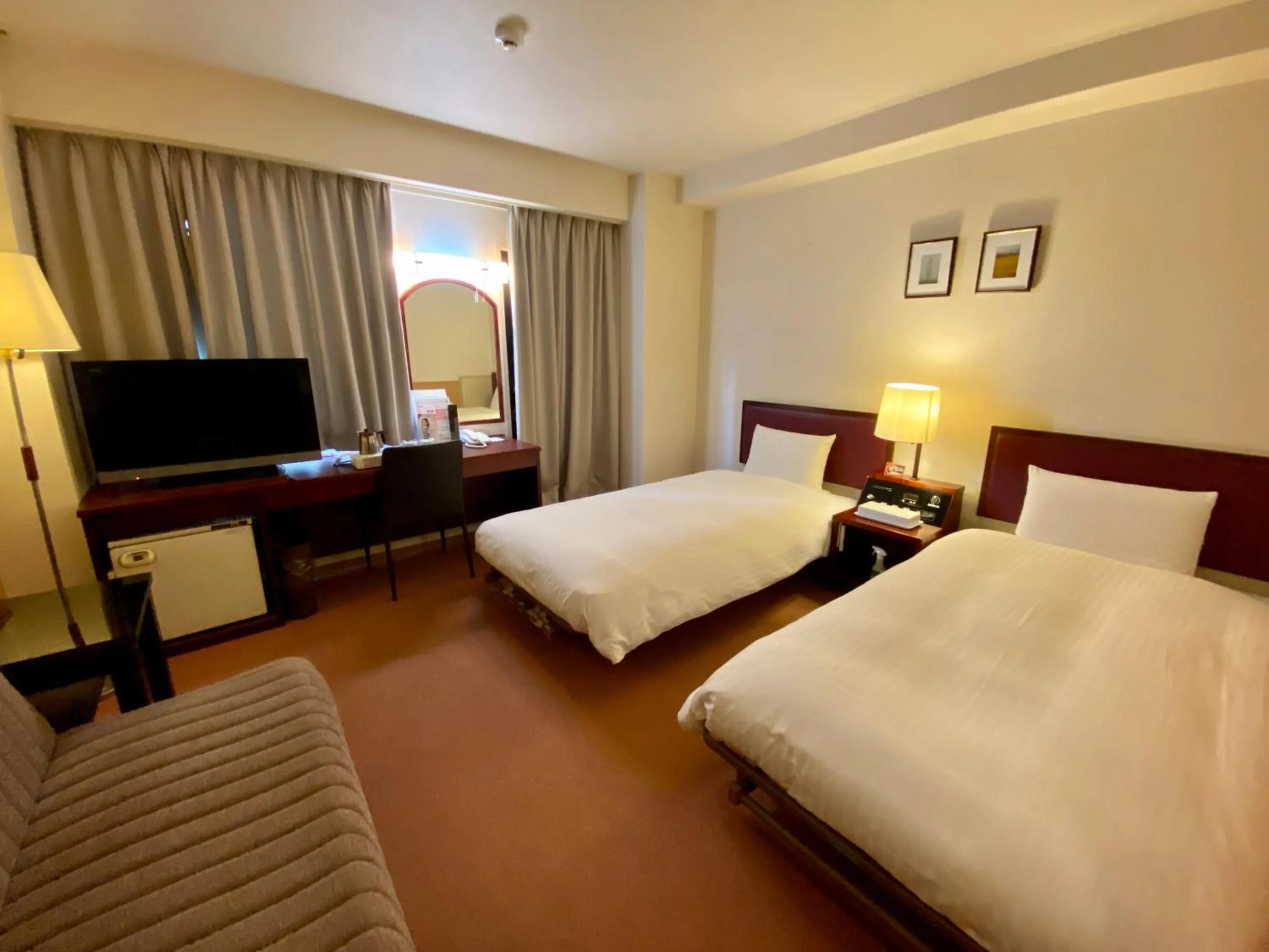 Bed in Smile Hotel Sasebo