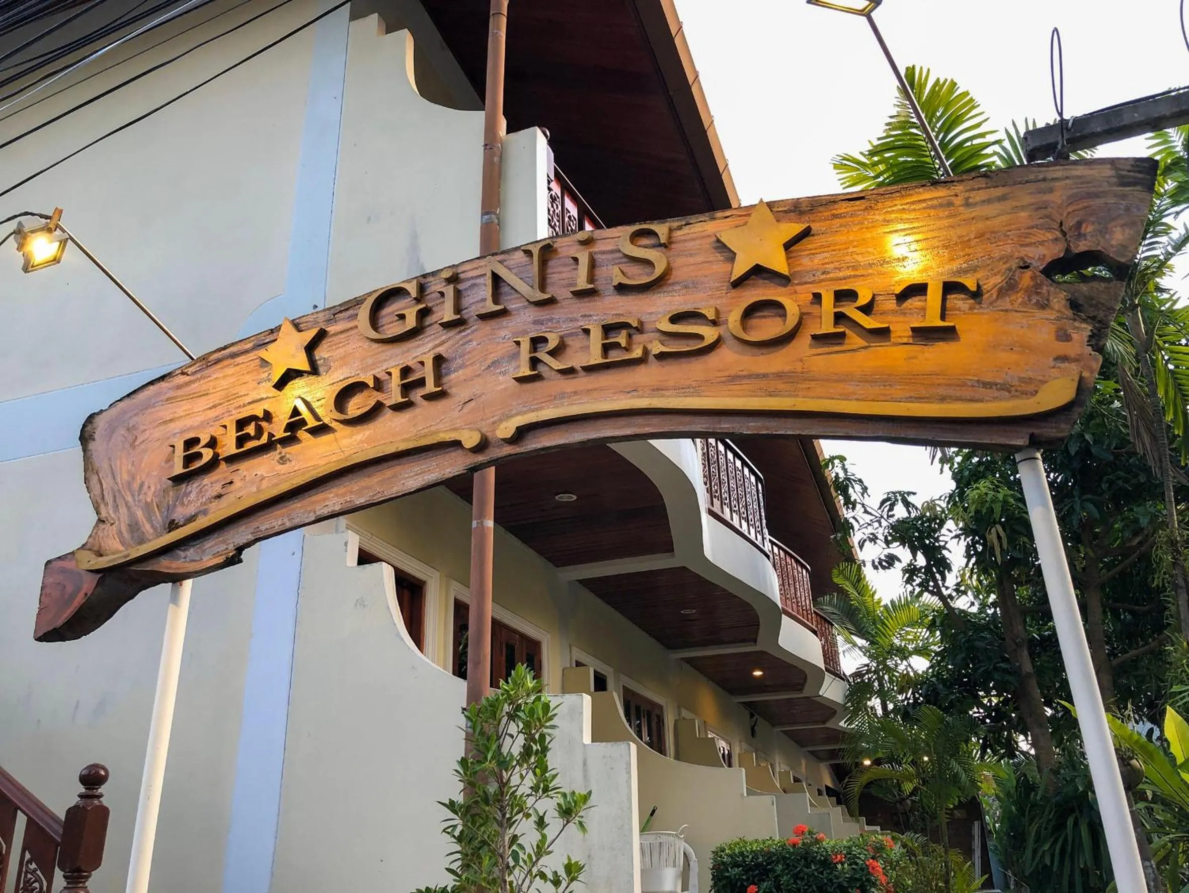 Property logo or sign in Ginis Beach Resort