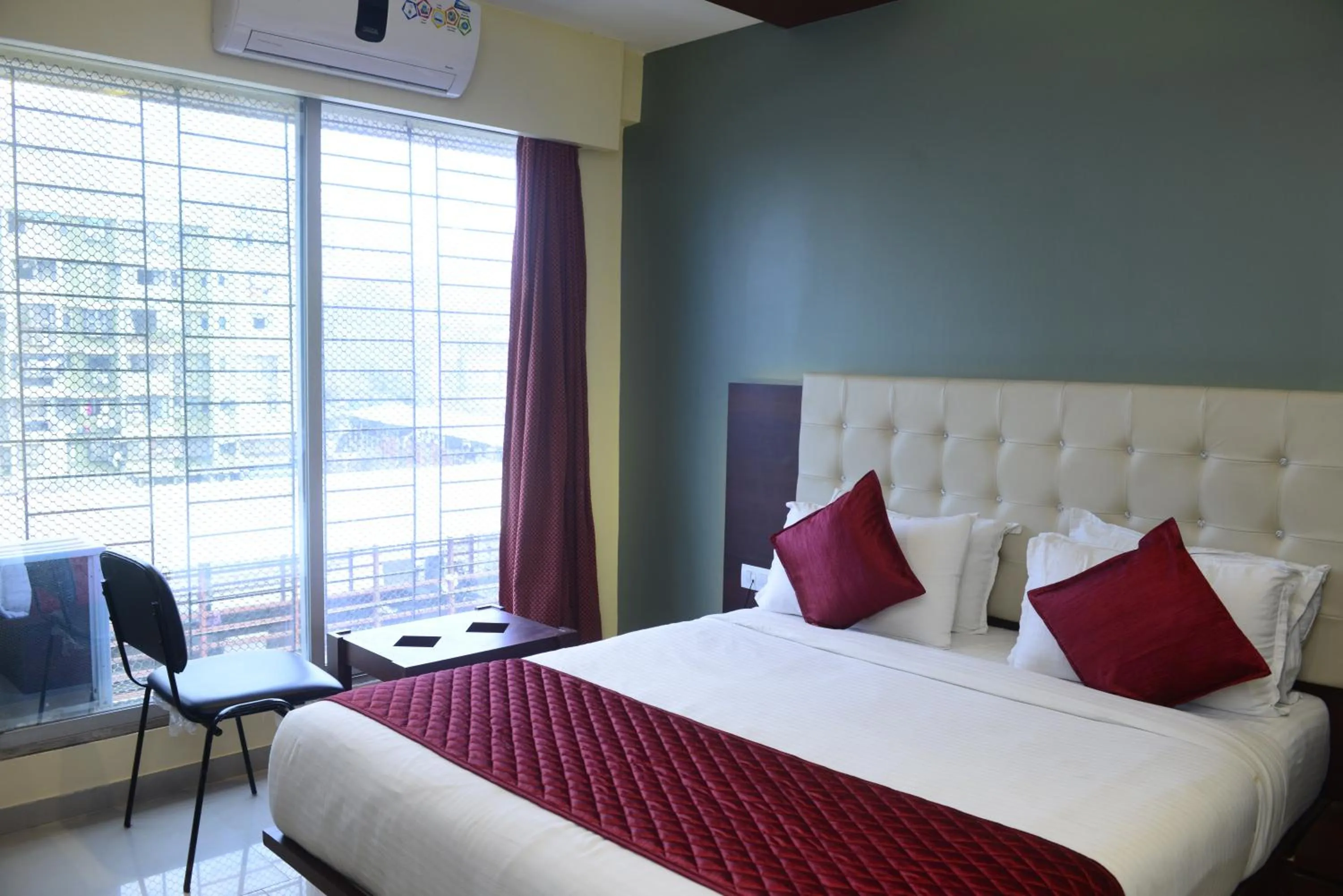 Photo of the whole room, Bed in Hotel Malad Inn opposite Malad Railway Station