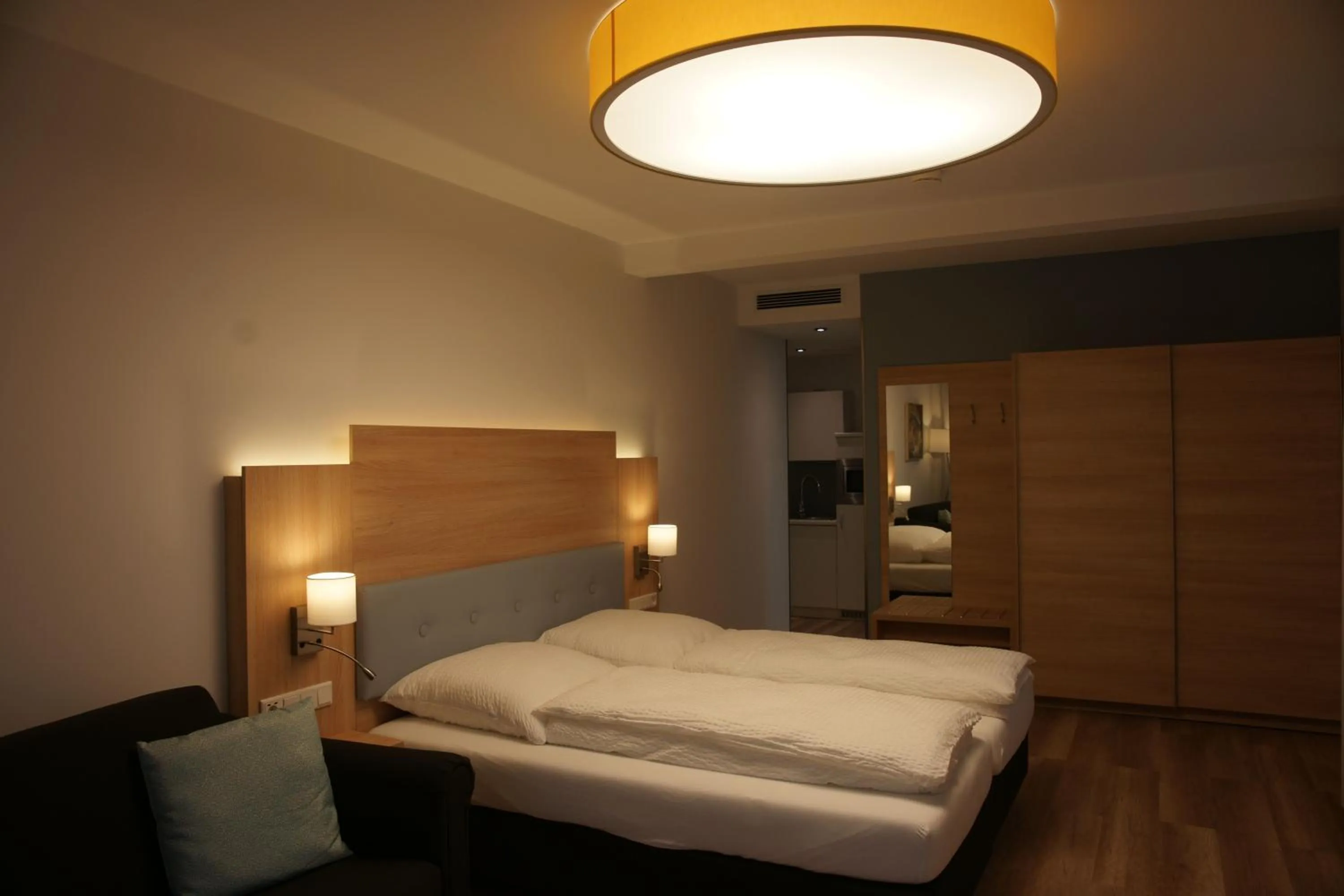 Bed in Leister Apparthotel