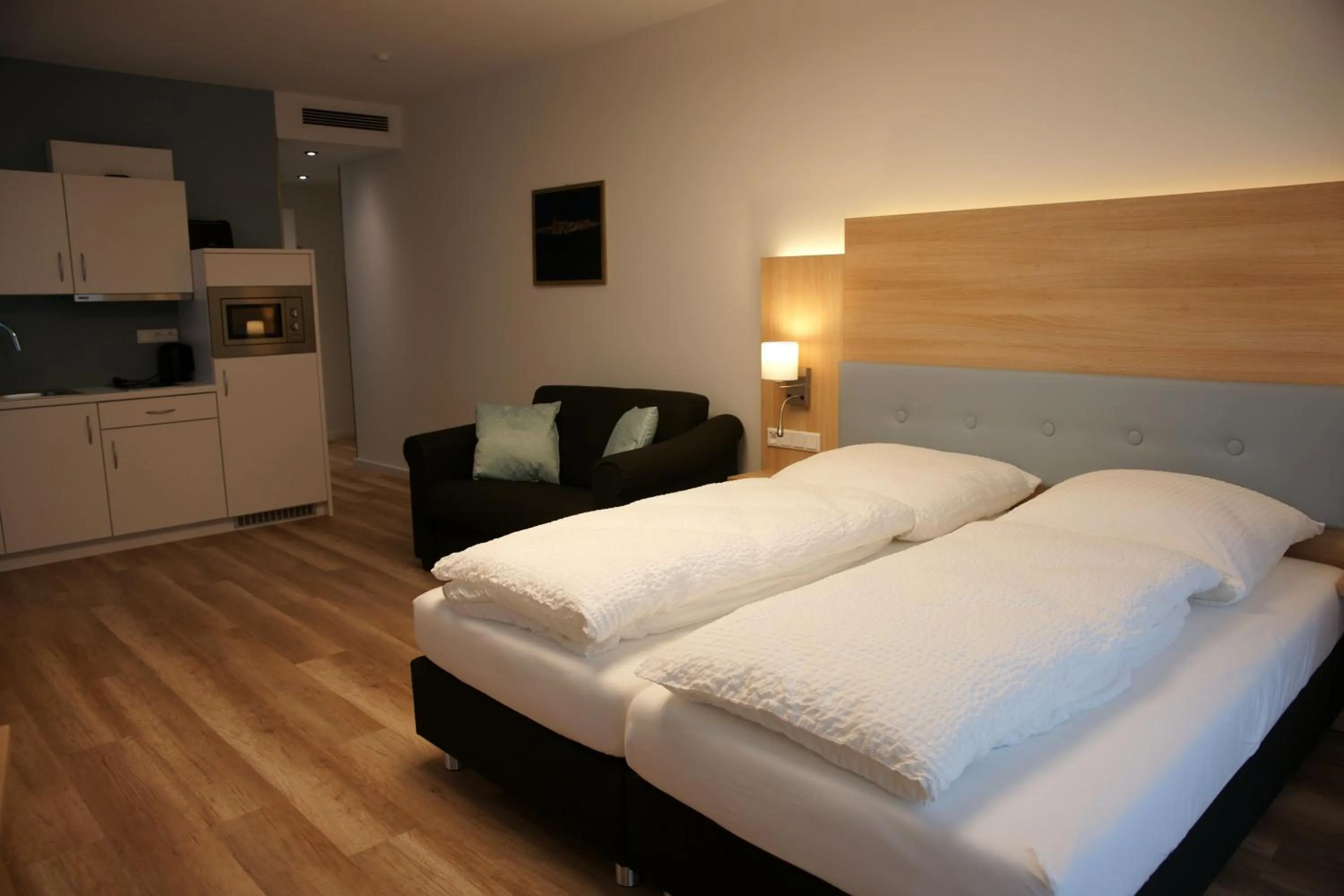 Bed in Leister Apparthotel